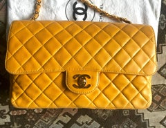Vintage Chanel classic 2.55 yellow lamb leather shoulder bag with golden CC.
