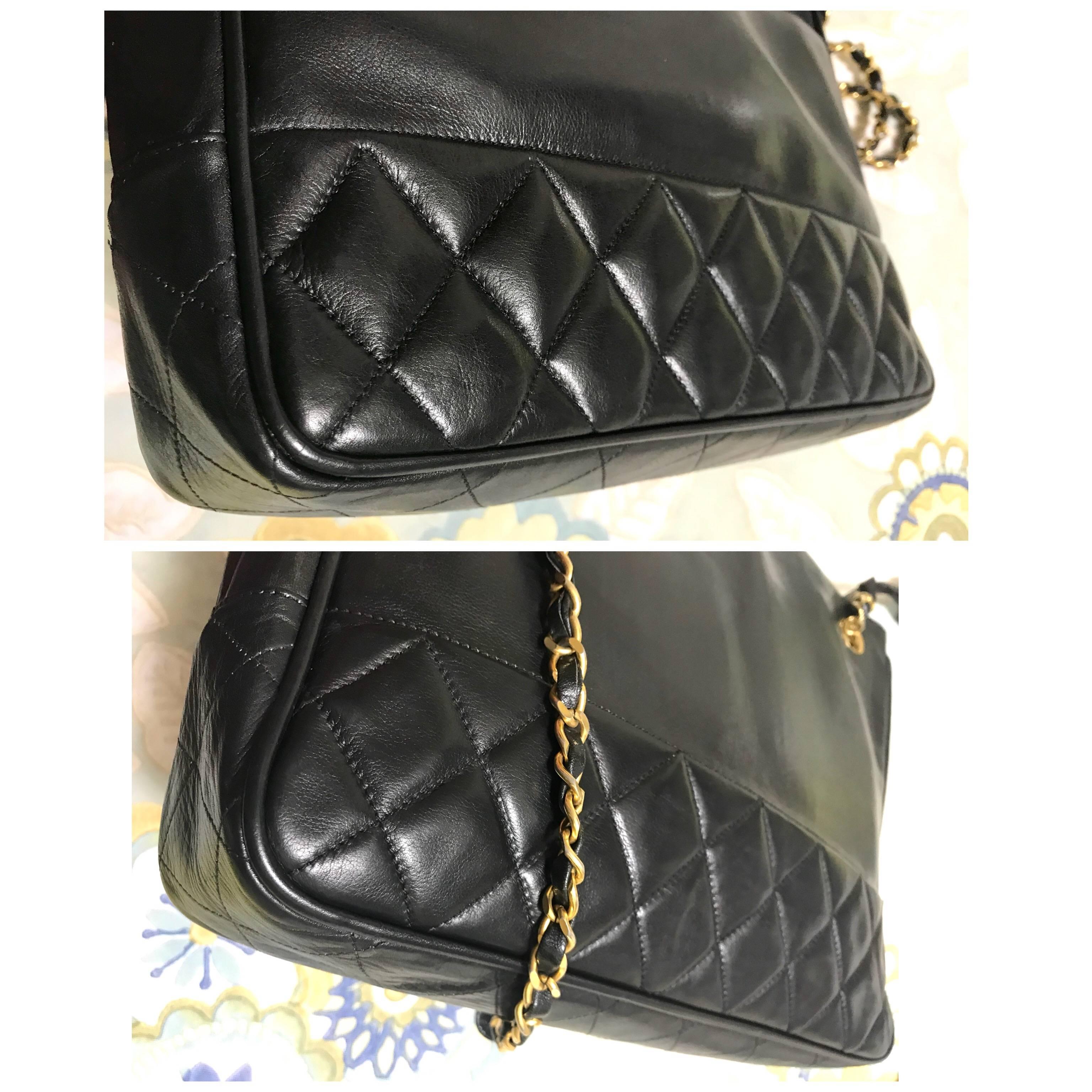 Women's or Men's Vintage CHANEL classic black leather shoulder bag, tote purse with golden chains