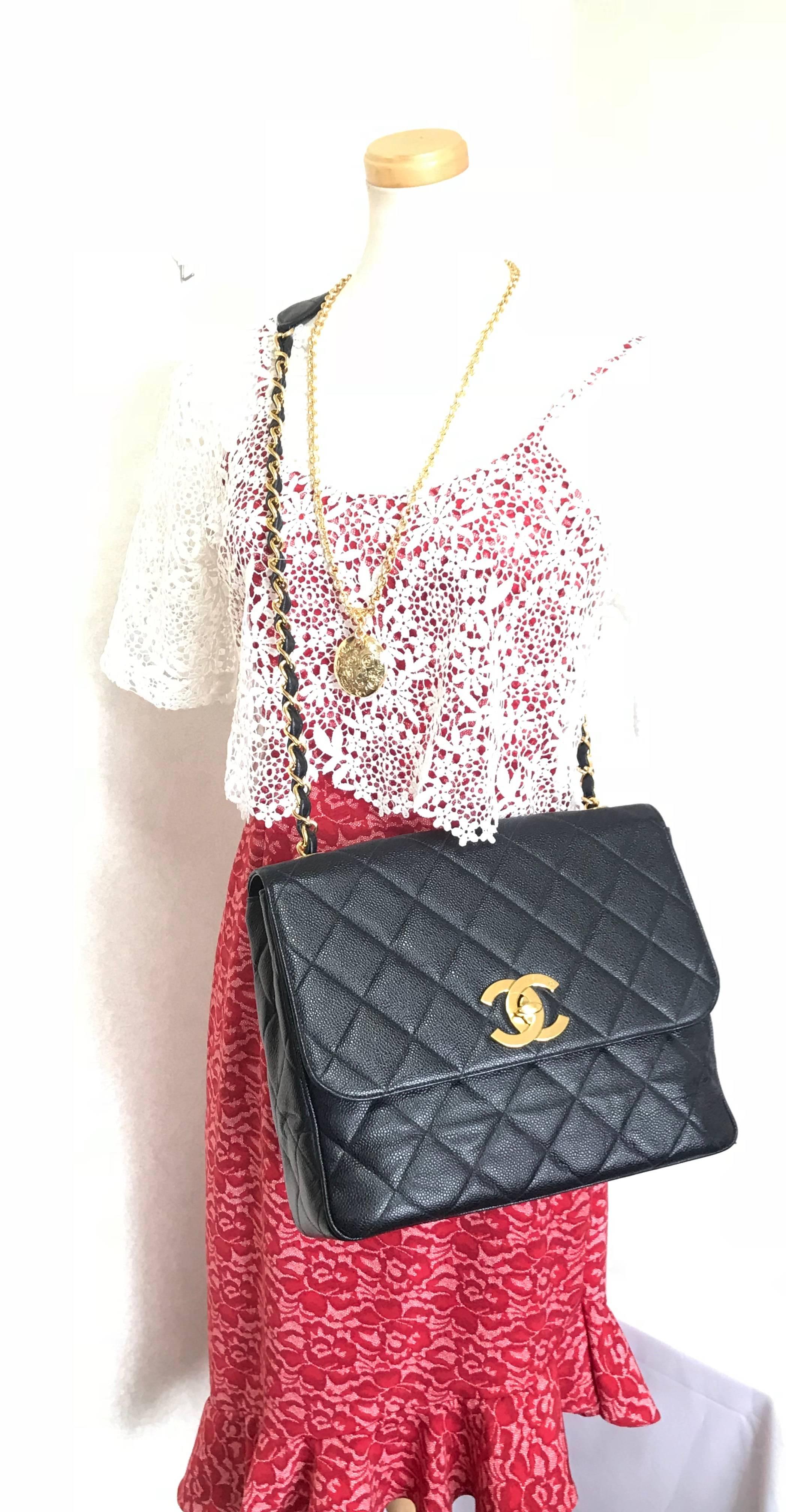 1990s. Vintage Chanel classic large black caviar leather 2.55 square shape chain shoulder bag with golden large CC closure. Must have purse.

***Smaller version in White and Beige is also for sale ***


Introducing a vintage Chanel classic 2.55