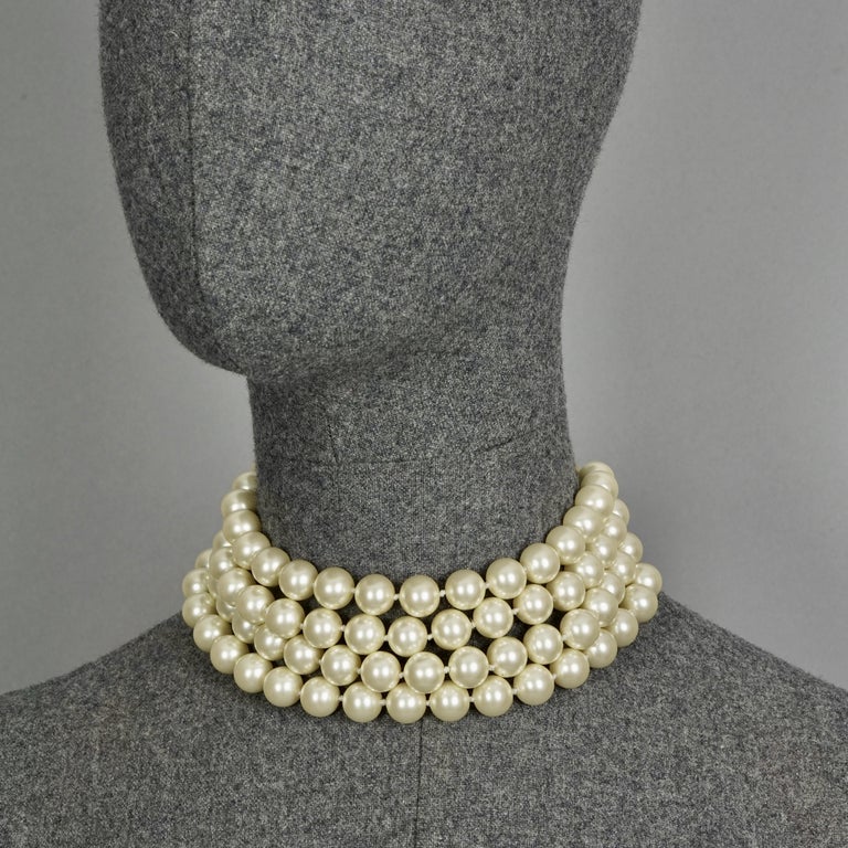 Vintage CHANEL Classic Multi Strand Pearl Choker Necklace

Measurements:
Height: 1.97 inches  (5 cm)
Wearable Length: 13.38 inches to 14.56 inches (34 cm to 37 cm)

Features:
- 100% Authentic CHANEL.
- Classic 4 tiered glass pearl strands choker