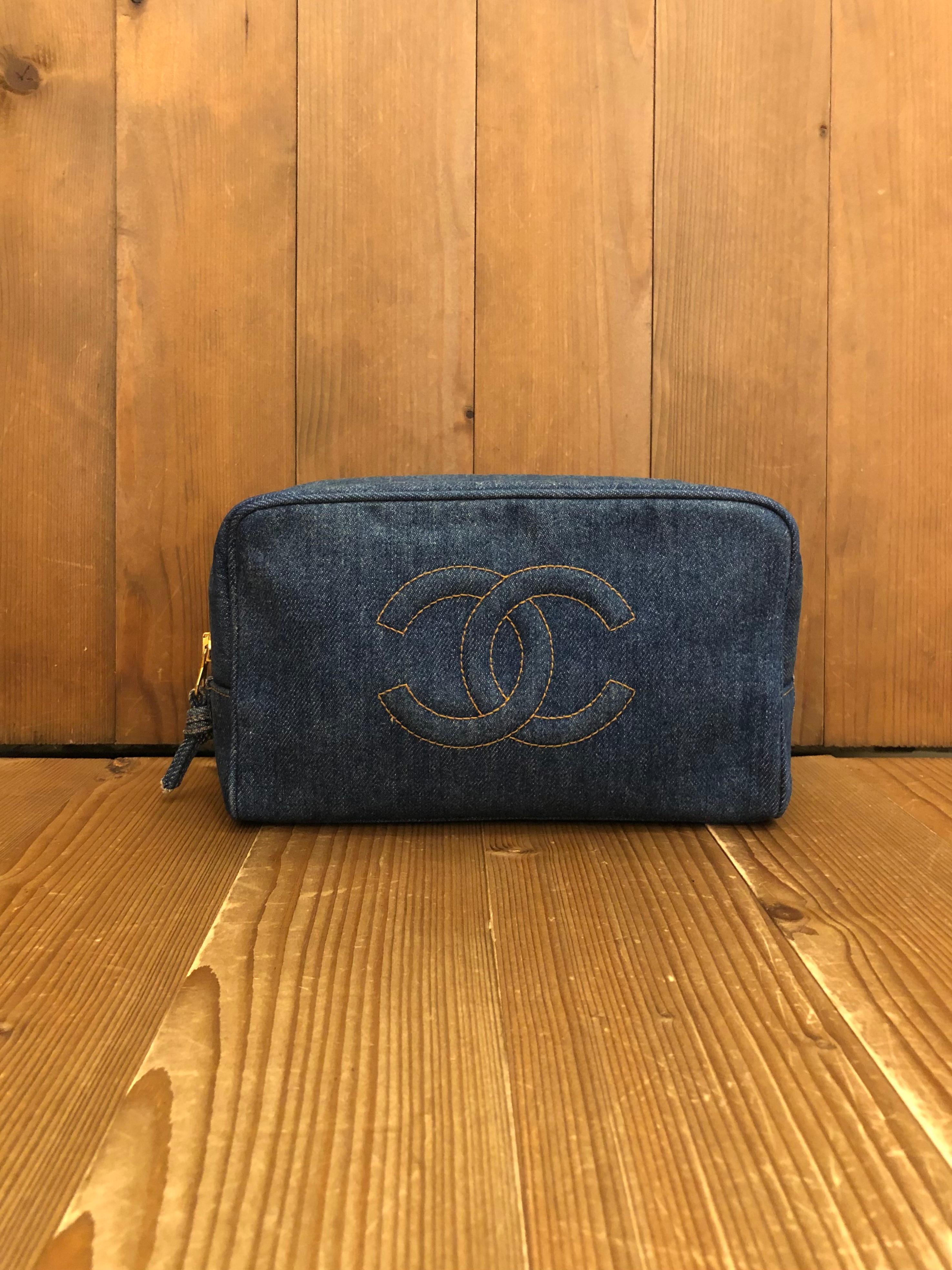 This vintage Chanel cosmetic pouch bag is crafted of denim in blue. Zip around closure opens to a black leather interior featuring a zippered pocket and elastic bands. Made in Italy. Serial no 4xxxxxx (1995 - 1997). Measures approximately 9 x 5.75 x