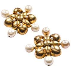 Retro  Chanel clip-on ear shape of a cross sign. 1970-1981, gold plated, faux pearls 