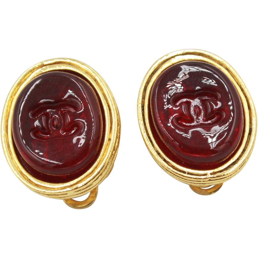 Vintage Chanel earrings in Gold metal and red poured glass