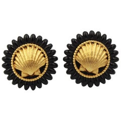 Vintage Chanel earrings with gold metal shell and black finishes.