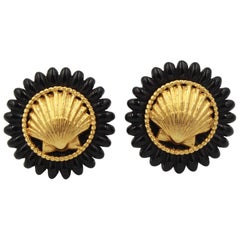 Vintage Chanel earrings with gold metal shell and black finishes. 