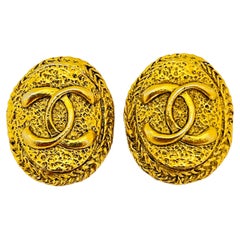 Vintage CHANEL gold CC logo designer runway clip on earrings