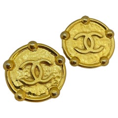 Vintage CHANEL gold CC logo medallion designer runway clip on earrings