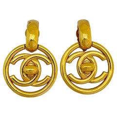 Vintage CHANEL gold CC logo turnlock door knocker runway clip on earrings