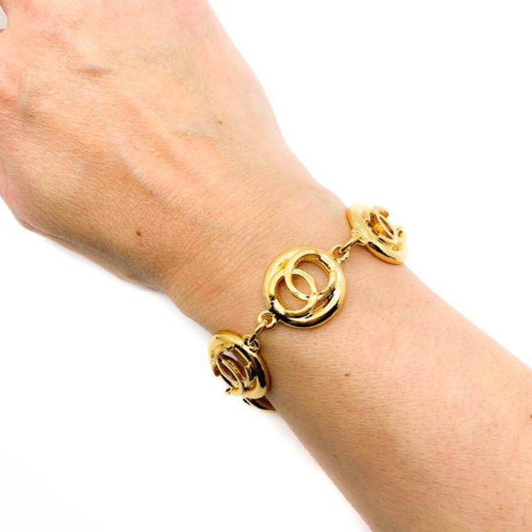 A fab Vintage Chanel CC Logo Bracelet from the 1980s and specifically 1983. Featuring no less than six chunky roundels with each one housing the iconic CC logo and all crafted in 18ct gold plated metal. Coco Chanel's signature symbol is