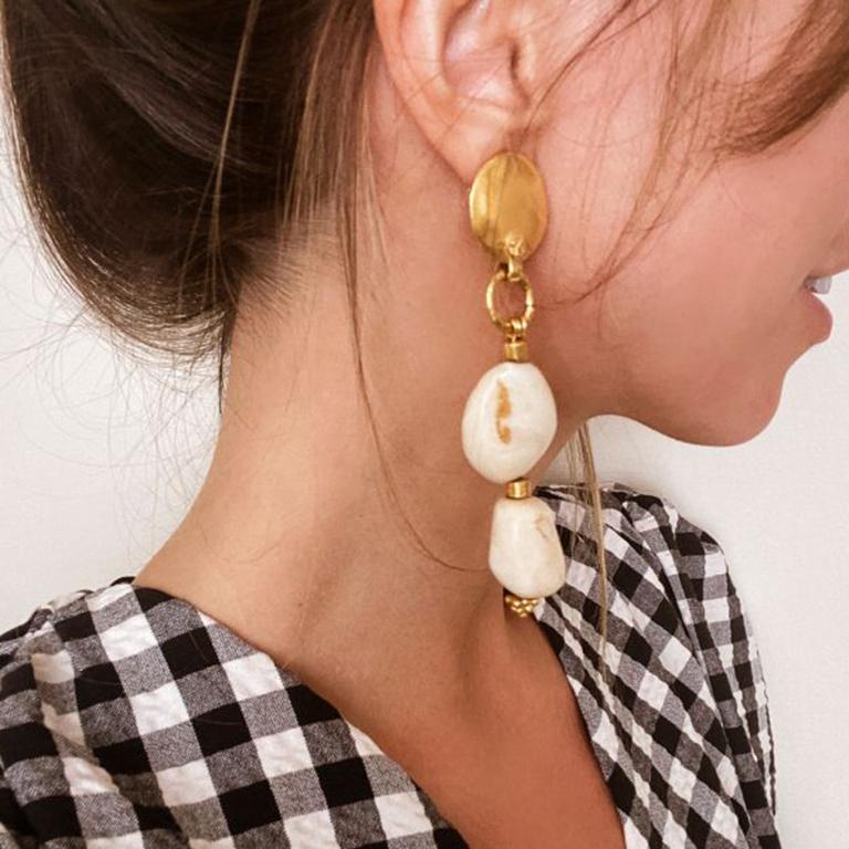 1990s Vintage Chanel Gold Pebble Logo Earrings. Beautiful summertime Earrings. Featuring brushed gold plated metal discs set with miniature CC logos giving way to faux marble resin drops and etruscan style gold plated finishings. Created for the