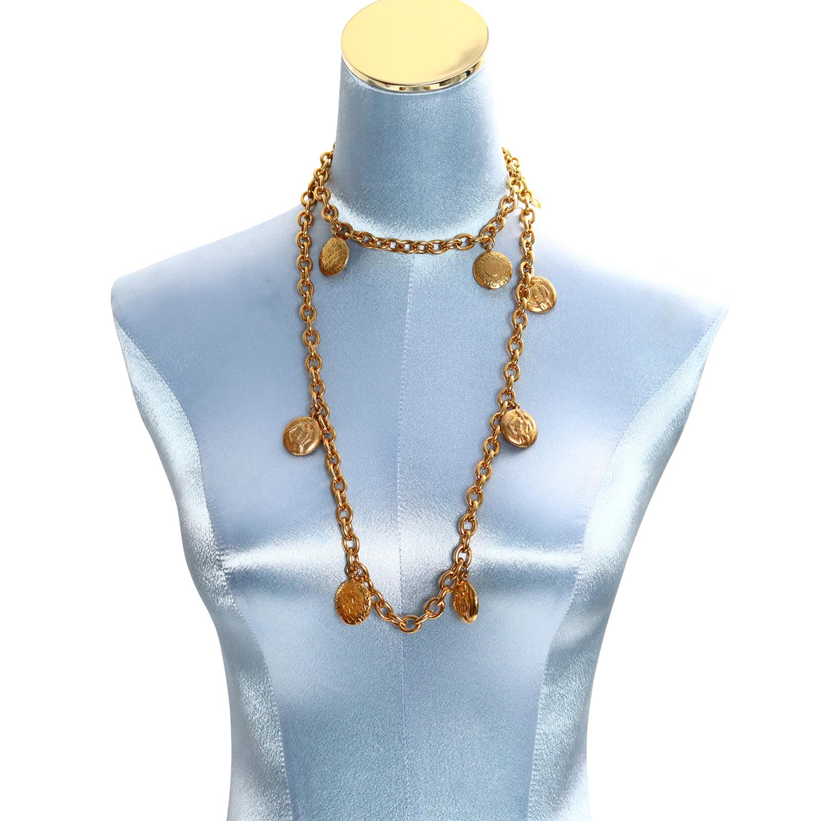 Vintage Chanel Gold Disc Chanel and Coco on Long Necklace. A great necklace from the 1980s with dangling discs that have an imprint of CoCo on one side and Chanel all over the other on a thick and heavy link chain in great shape.  Can be doubled and