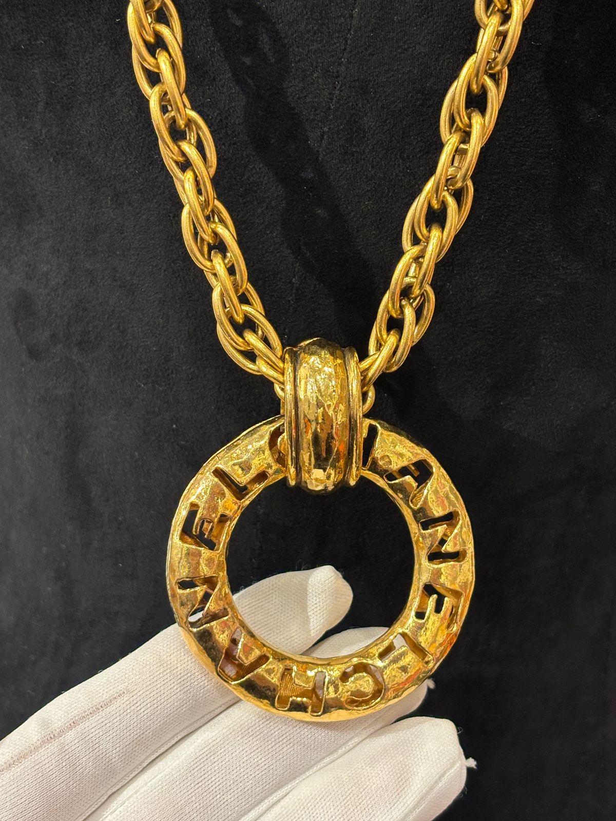 Vintage Chanel necklace in gold chain with big quilted hoop pendant detail. Beautiful vintage piece. 24k gold plated. Can be worn as layered necklace as well. Light tarnishing on the hardware. Comes as is.
