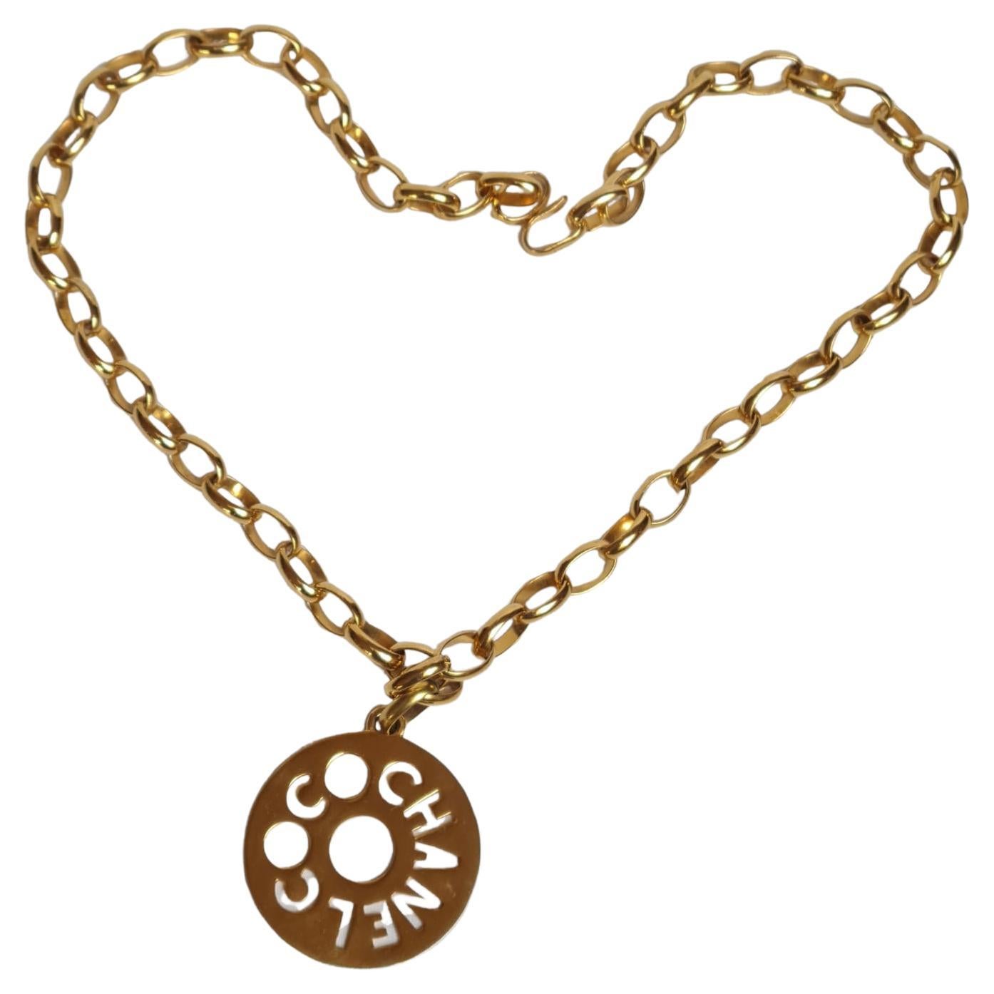 Vintage Chanel Gold Logo Cut Out Pendant Necklace For Sale