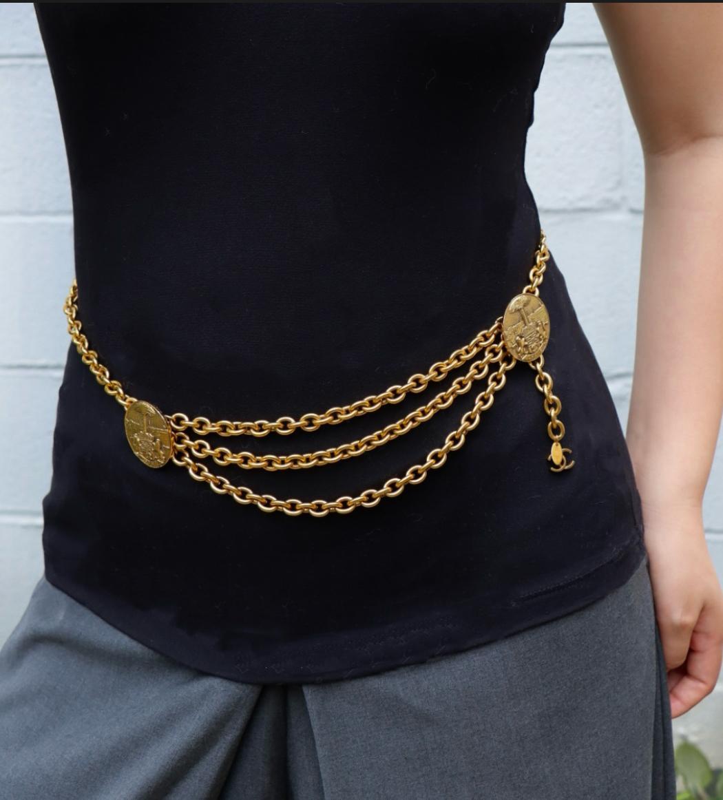 Vintage Chanel Gold Tone Medal Chain Belt

Approximate Dimensions:
87 cm (Length) 
0.9 cm - 3.5 cm (Width) 
217.8 grams in weight.