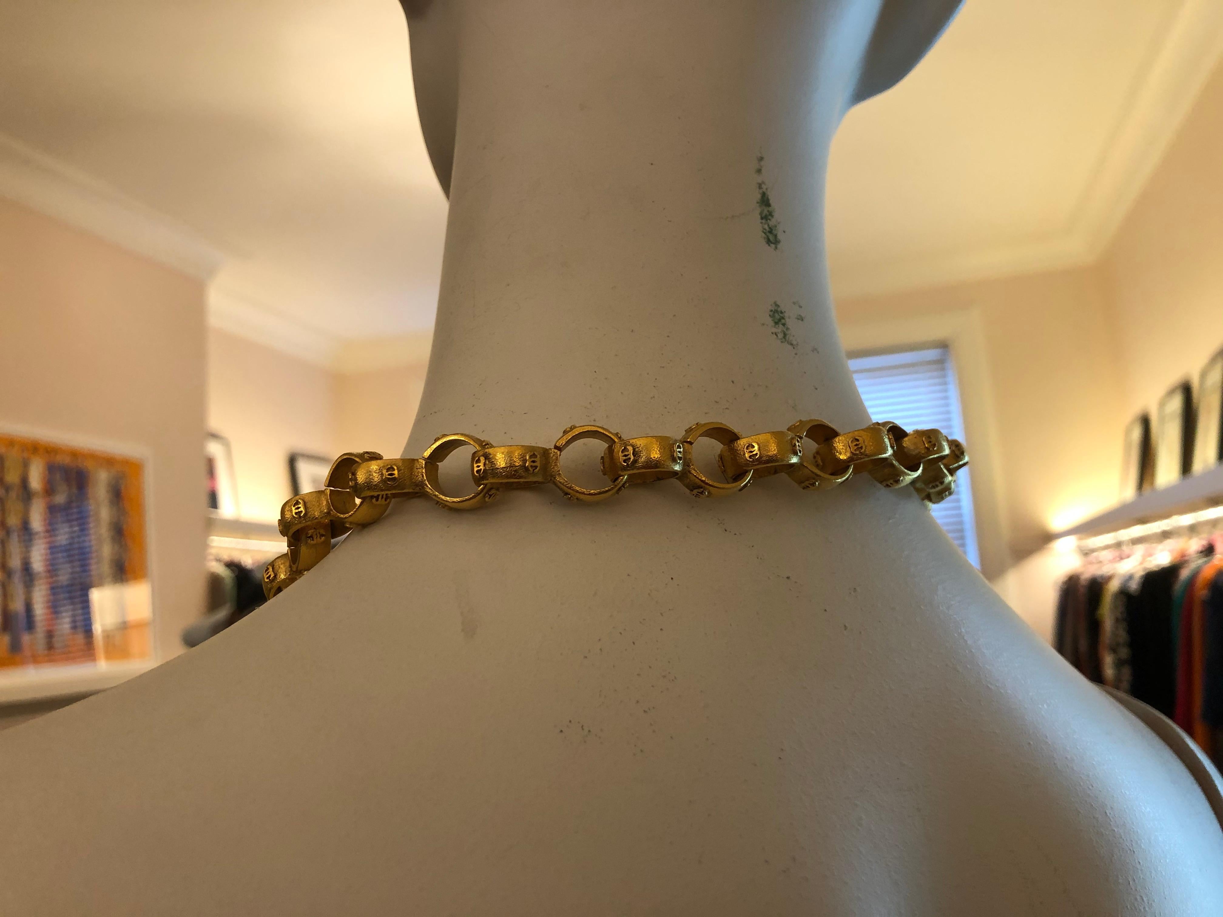 Substantial Chanel necklace from the 1984-90 period. The chain is made of rings with the CC emblem and the oval disc describes the era of the piece as well as the Chanel name with the copyright mark and made in France. The necklace comes with a