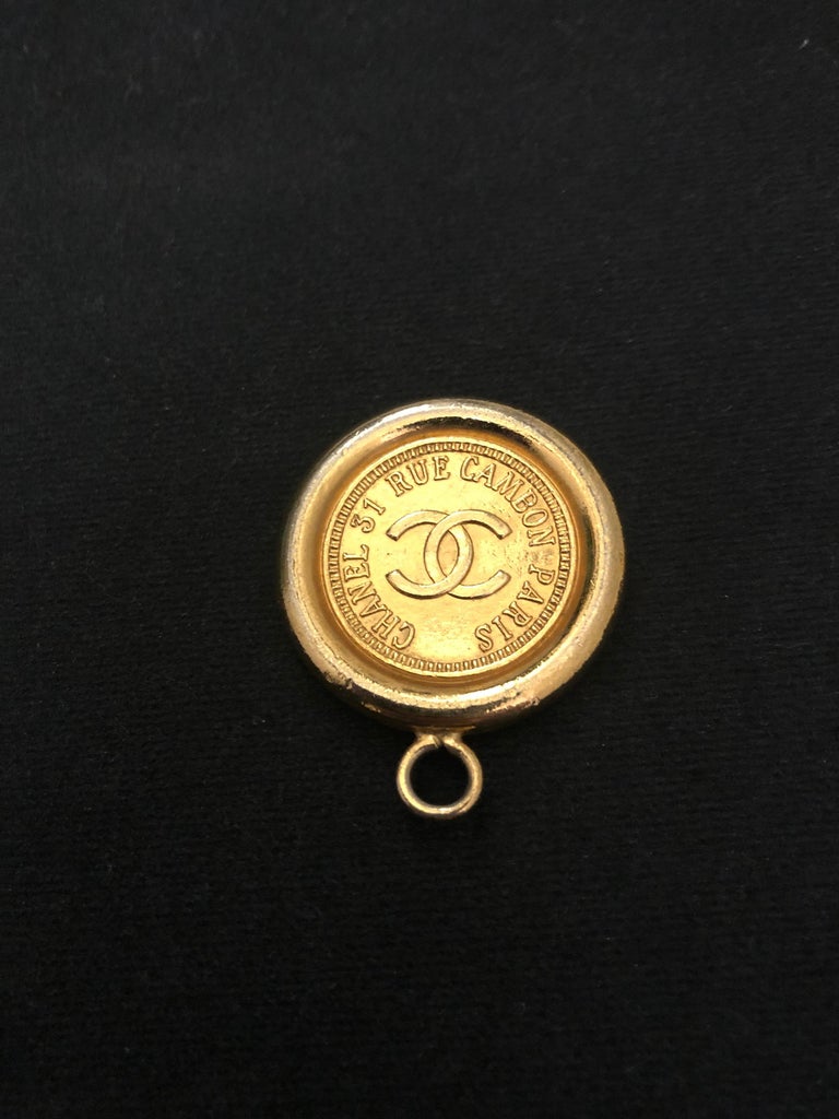Vintage CHANEL Gold Toned Cambon Coin Pendant Charm For Sale at 1stDibs