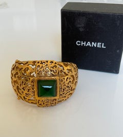 Vintage CHANEL 80’s Haute Couture Gold Cuff CC logo & green stone