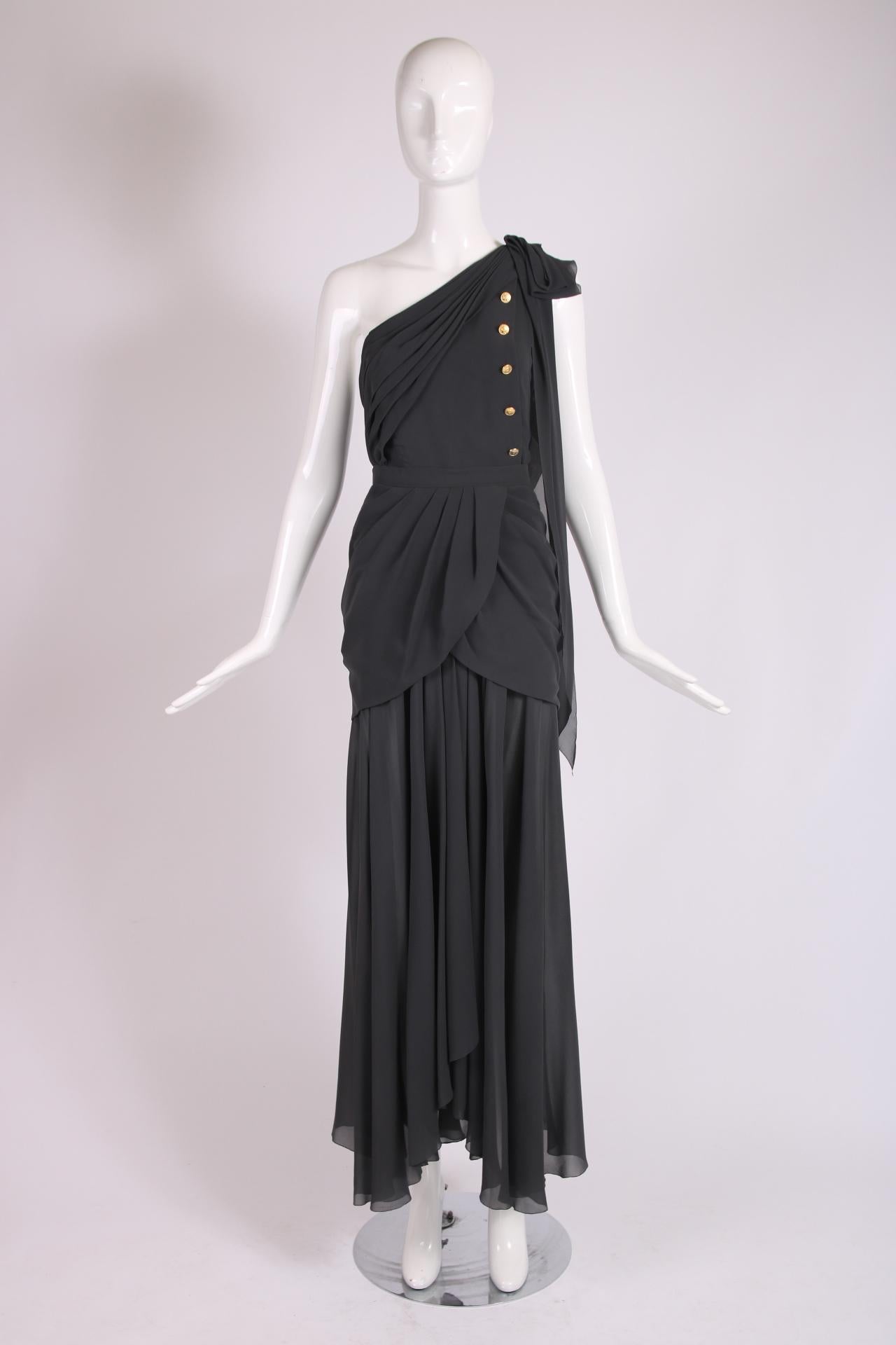 1989 Chanel slate gray, Grecian-inspired skirt and top ensemble with dramatic draping, a slit at center front and subtle hi-low hem. The bodice/top features design details such as diagonal ruching, a single long tie at shoulder left which drapes