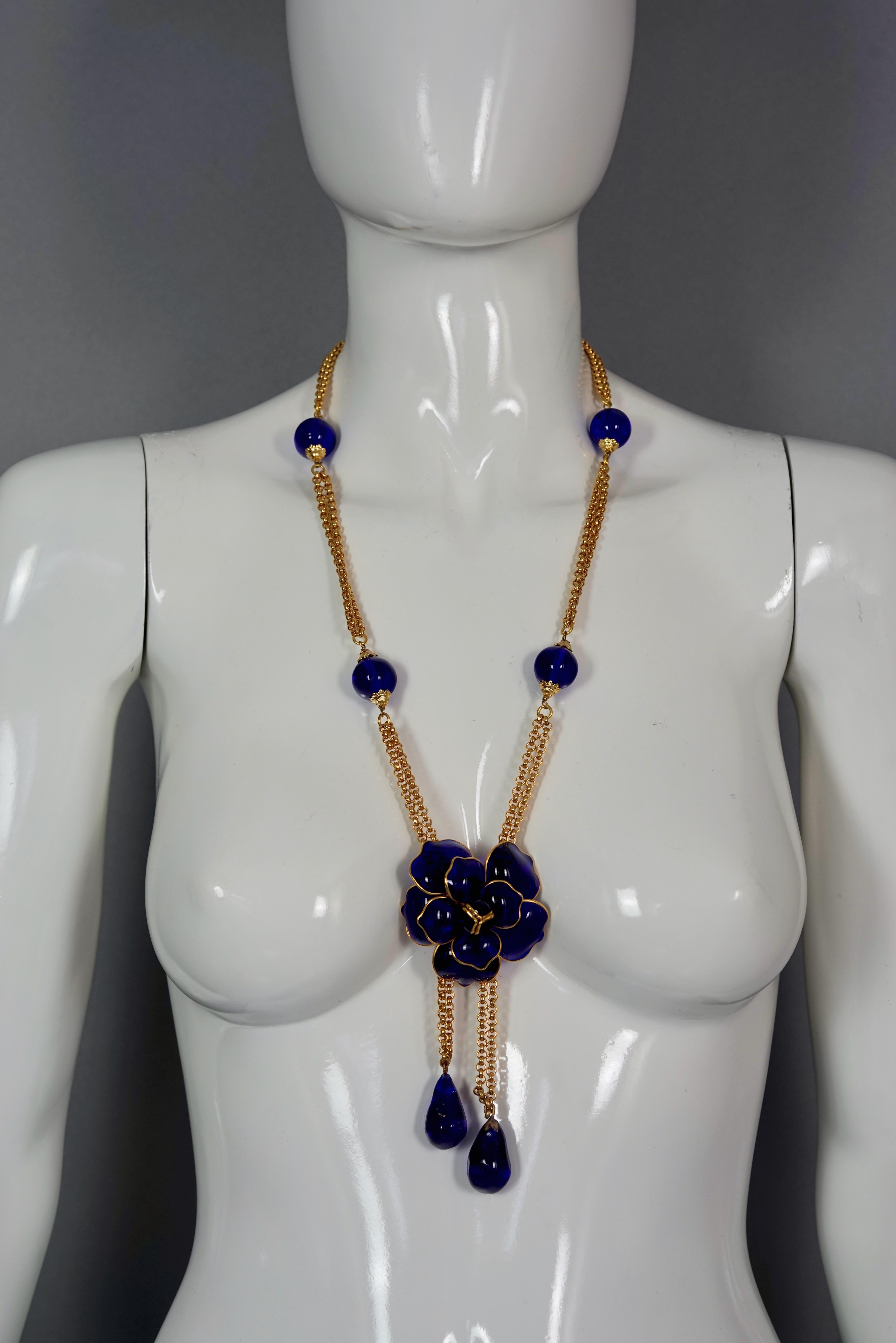 Vintage CHANEL GRIPOIX Blue Camellia Flower Multi Chain Necklace

Measurements:
Pendant Drop: 5.11 inches (13 cm)
Wearable Length: 27.55 inches to 29.72 inches (70 cm to 75.5 cm)

Features:
- 100% Authentic CHANEL.
- Blue Gripoix/ poured glass