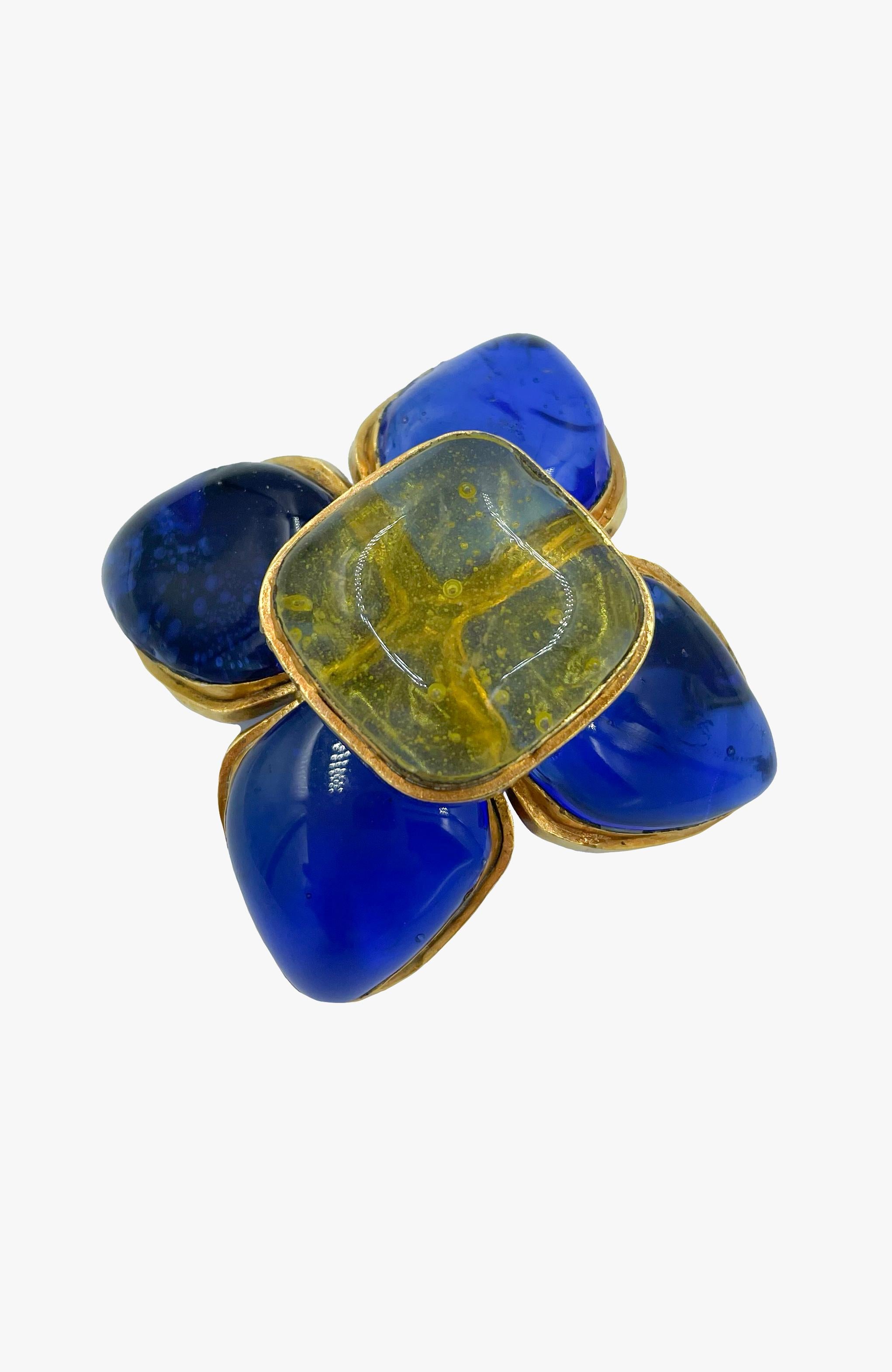 Chanel brooch made of Gripoix glass in a form of 4-petal flower in blue and yellow colors. 
Marked. 
Season 26. 1989 year. 
Measurements: 
Length - 8 cm
Width -  7 cm
Condition: good; some scratches throughout metal. 

........Additional information