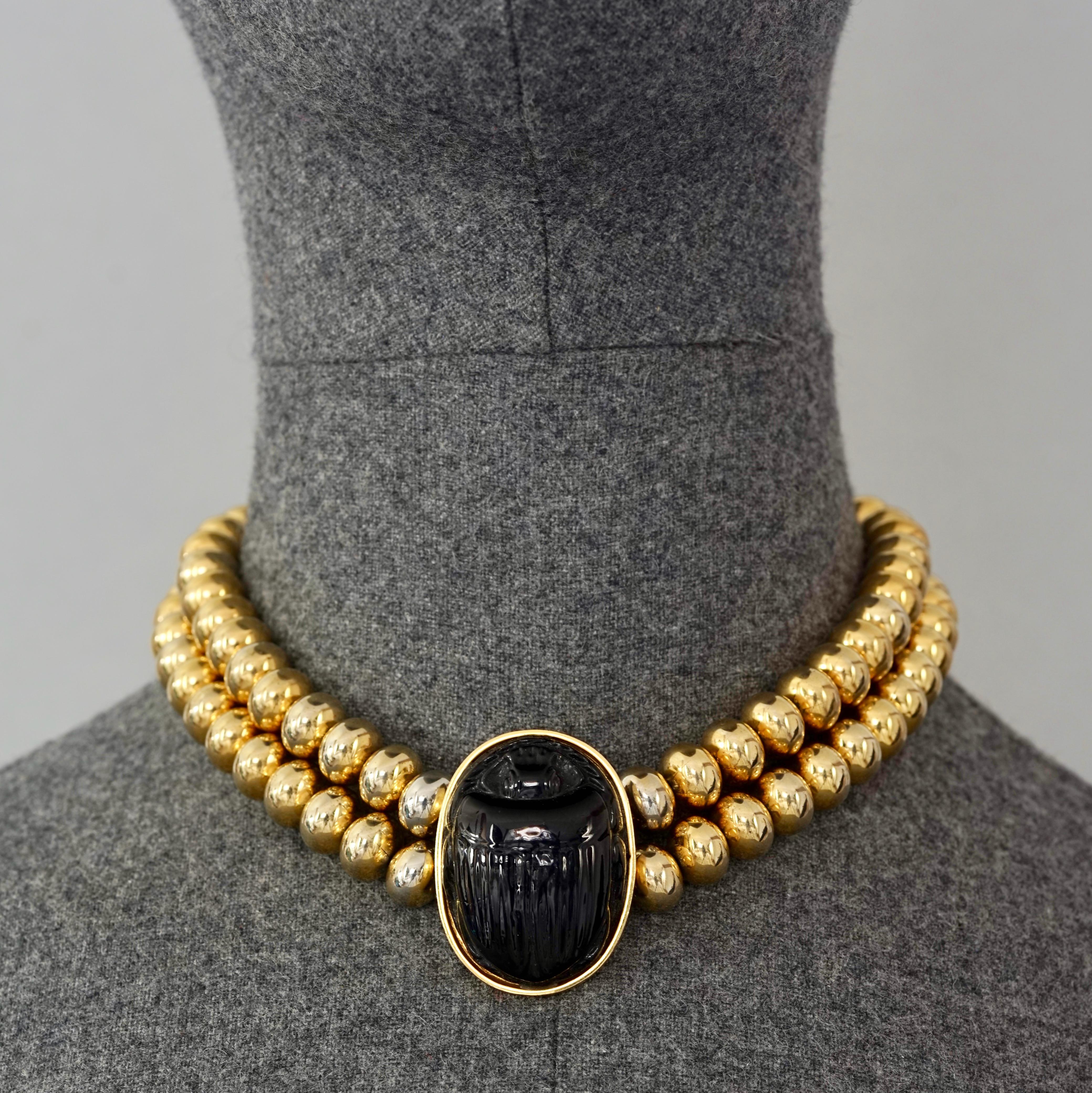 Vintage CHANEL Gripoix Scarab Egyptian Revival Double Strand Necklace

Measurements:
Height: 1.57 inches  (4 cm)
Wearable Length: 14.76 inches (37.5 cm)

Features:
- 100% Authentic CHANEL.
- Black Gripoix/ pate de verre scarab with double ball chain