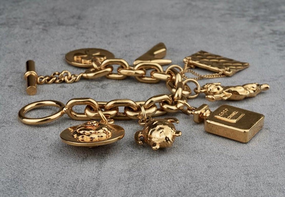 Vintage CHANEL Iconic Charms Bracelet

Measurements:
Length: 8 inches
Clover Leaf Charm: 1 1/4 inches X 1 1/4 inches
High Heeled Shoe: 1 3/4 inches X 3/4 inch
Perfume Bottle: 1 3/8 inches X 1 inch
Angel: 1 6/8 inches X 1 1/8 inch
Quilted Purse: 1