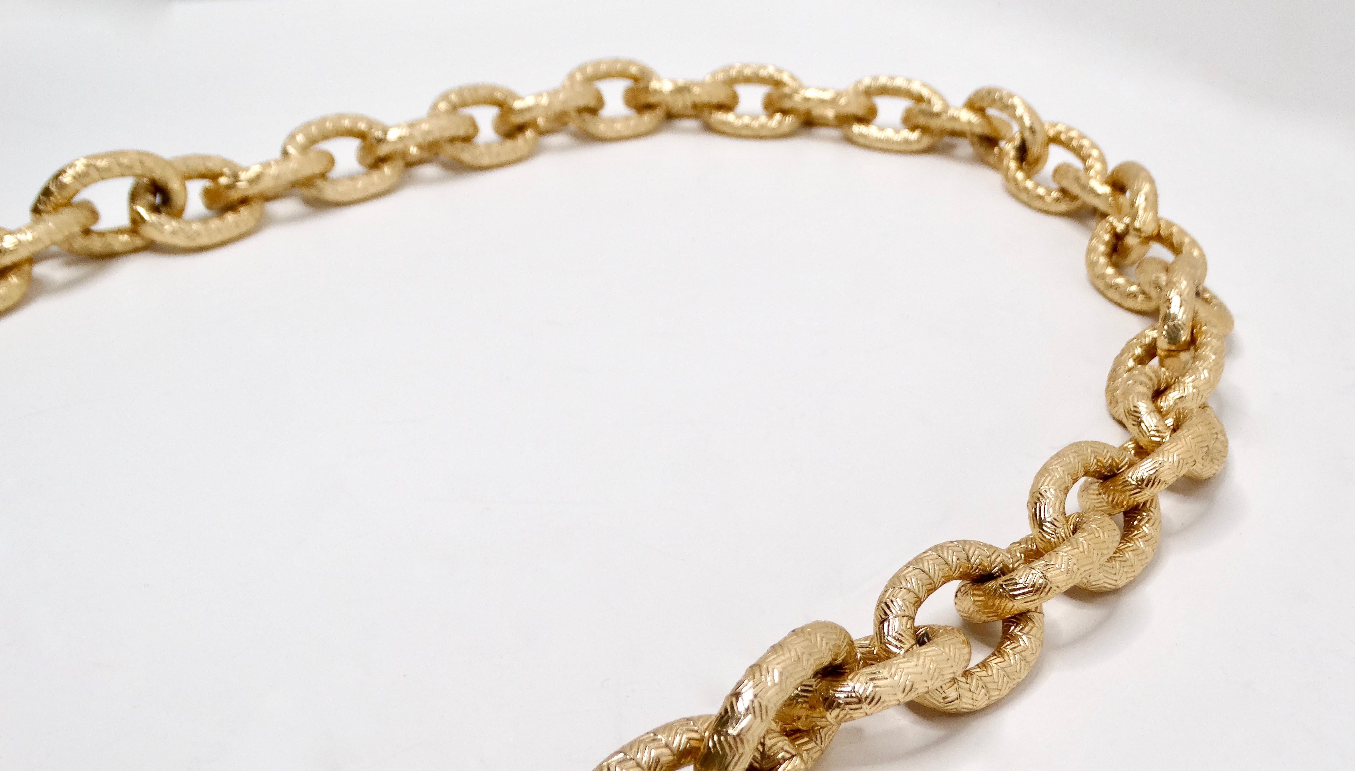 Introducing our Vintage Chanel Inspired 14k Gold Plated Chunky Textured Chain Link Necklace, a statement piece that embodies timeless elegance and modern sophistication. This necklace features an intricate textured chain design, capturing the