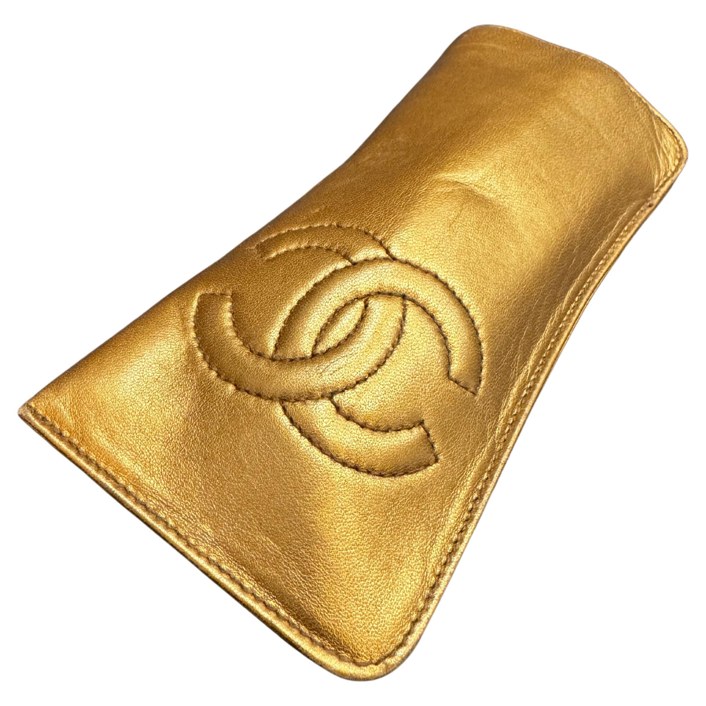 This vintage Chanel glasses case is crafted of lambskin leather in copper-gold color. Made in Italy. Holo 2xxxxxx series (1991-1994). Measures approximately 6.25 x 2.75 inches. Sunglasses in the picture are for photography and not included. Comes