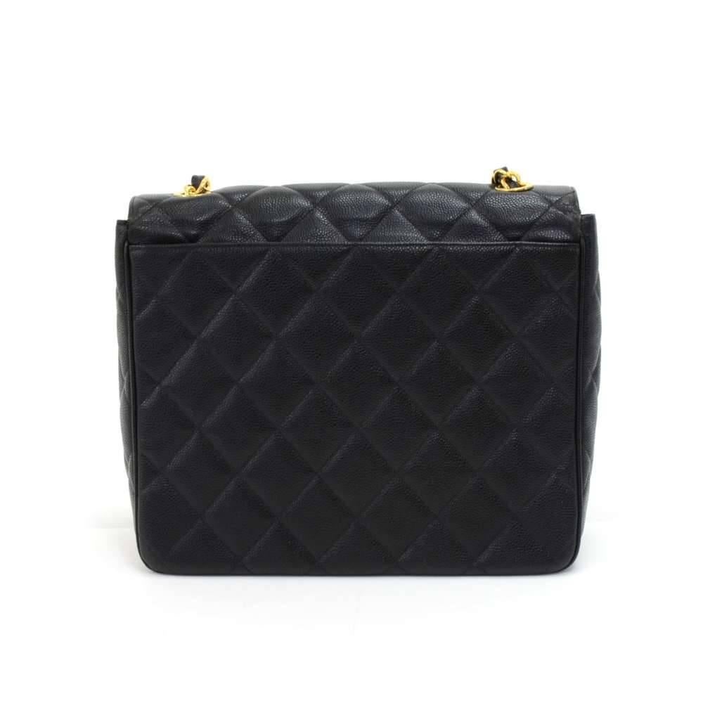 Vintage Chanel Flap shoulder bag in black quilted caviar Leather. There is one slip pocket on the back and the front has a flap wit ha large gold-tone CC logo twist lock. Inside is lined with black leather and feautures one slip and one zipper