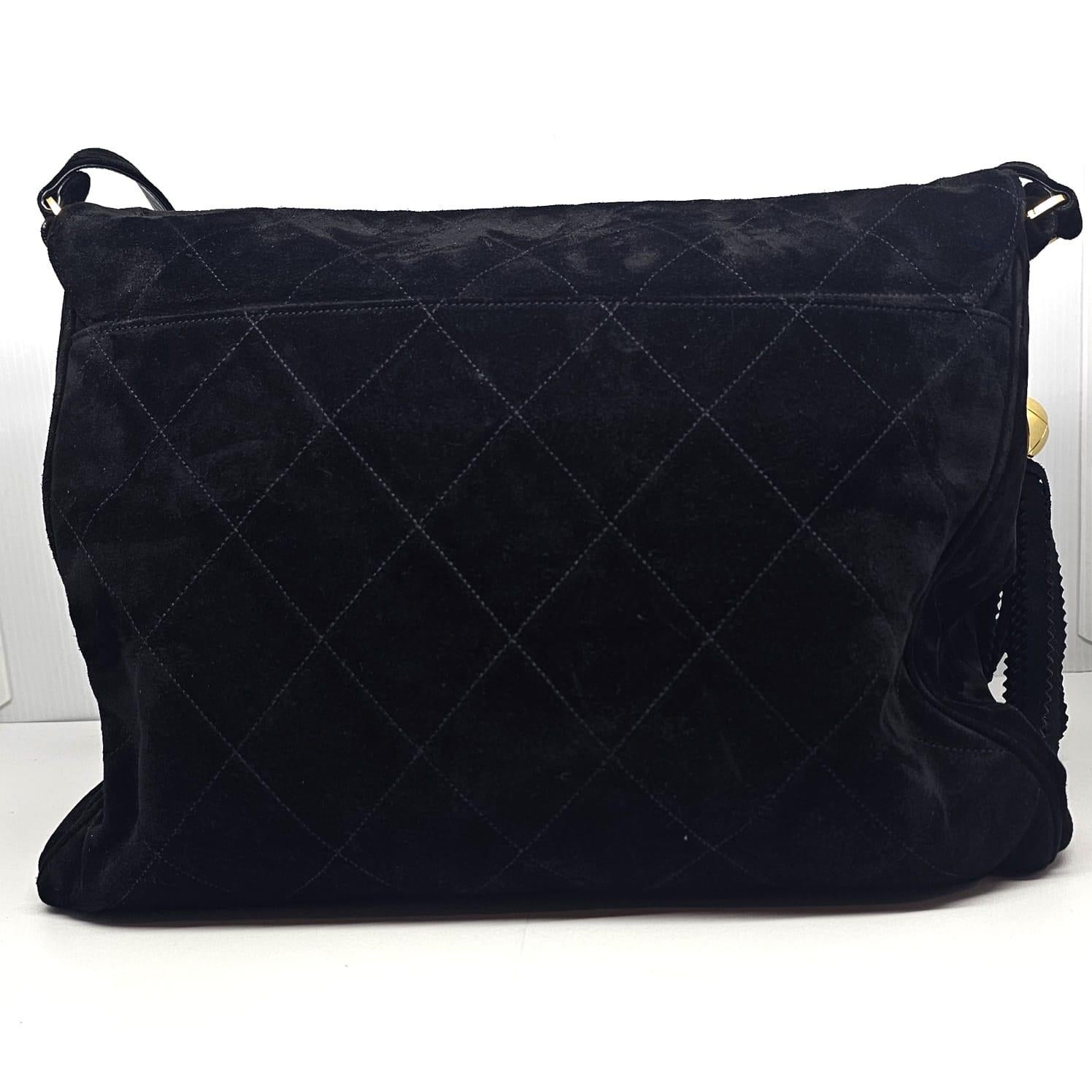 Women's or Men's Vintage Chanel Large Black Suede Quilted Messenger Bag with Tassel Details