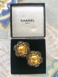 Vintage CHANEL large flower earrings with CC and gunmetal color gripoix stones.
