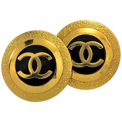 Vintage Chanel Large Gold Tone Earrings  Black Center Accented With CC Logo 1993