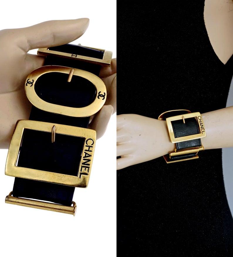 Vintage CHANEL Logo Multi Buckle Leather Cuff Bracelet

Measurements:
Height: 2.12 inches (5.4 cm)
Wearable Size: 6.85 inches (17.4 cm) 

Features: 
- 100% Authentic CHANEL.
- Wide leather cuff bracelet adorn with multiple buckles.
- Buckles are