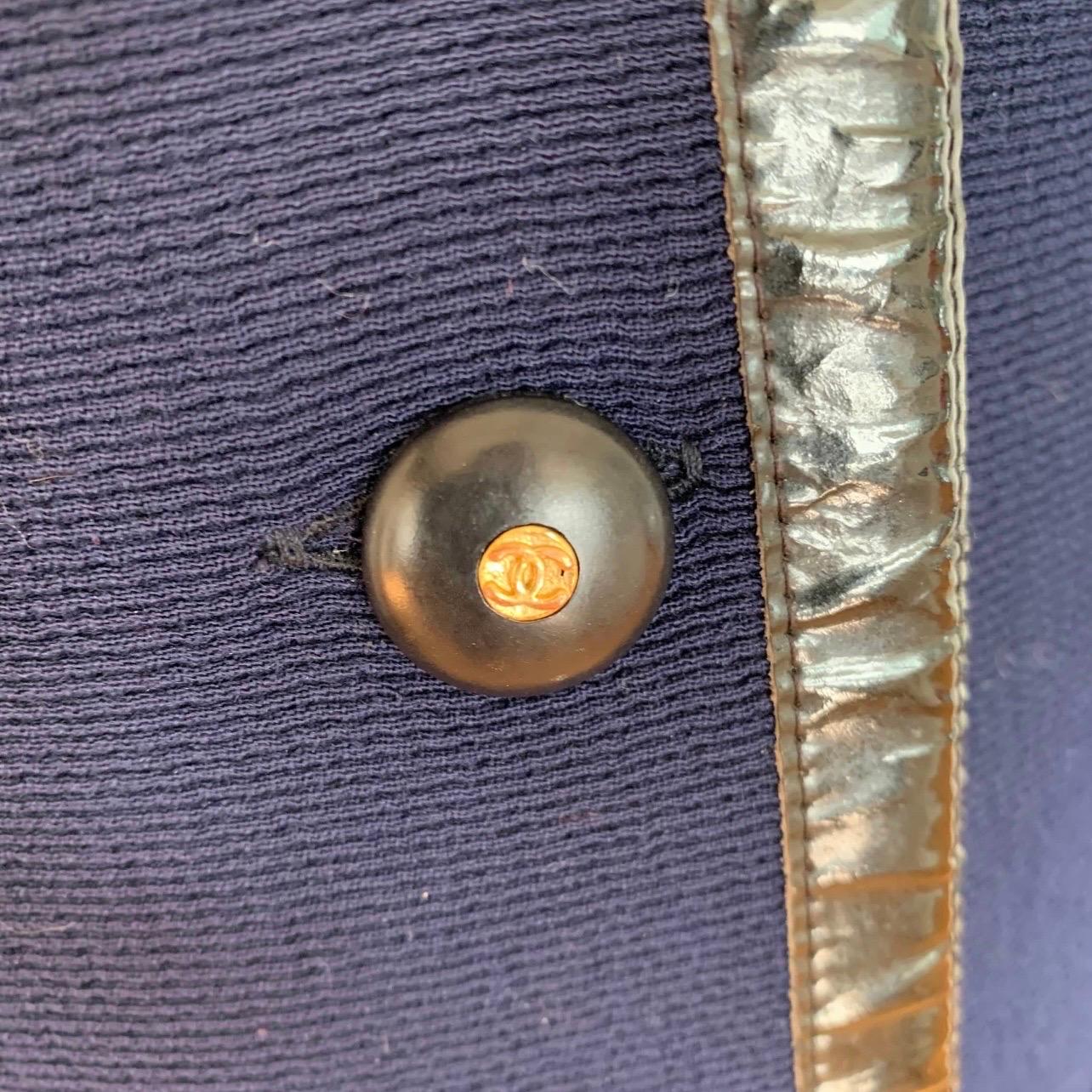 Vintage CHANEL Boutique long blue and black wool coat with CC logo buttons.🖤

Excellent condition!

size: 44/ 4-8 depending on desired fit
fabric: wool 
bust: 19
length: 38
sleeve 23.5

Blue and black wool coat, features 12 cc logo buttons up the