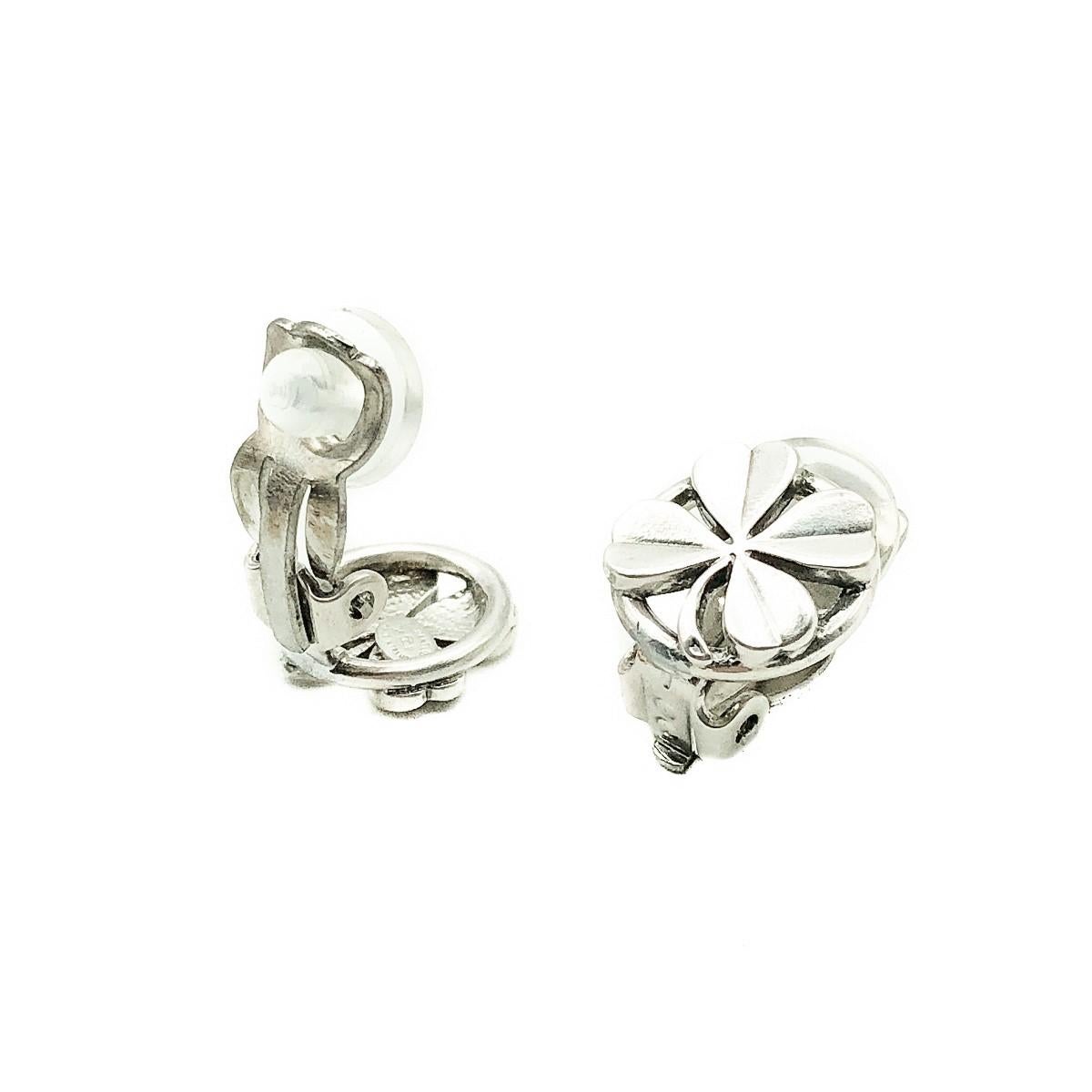 A delightful touch of couture. Vintage Chanel Lucky Shamrock Earrings. Featuring a four leaf clover symbolising luck and one of Coco Chanel's talismans. Crafted in silver tone metal. In very good vintage condition, signed, approx. 1.2cm diameter.