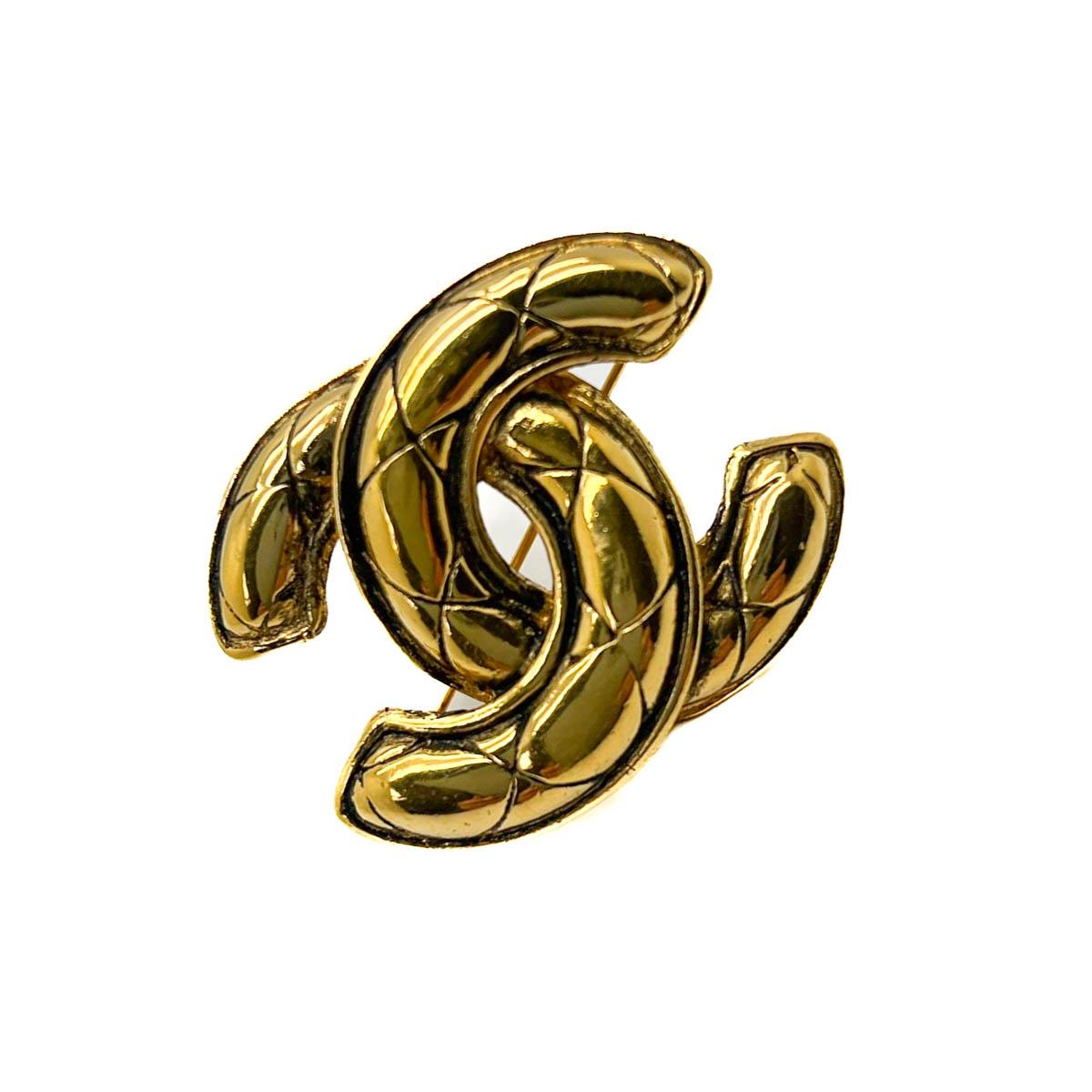A Vintage Chanel CC Brooch with the iconic matelassé design. The matelassé, or quilted pattern,  is symbolic of the House since February 1955 when Coco Chanel launched her iconic 2.55 quilted leather bag. The quilting reminiscent of the jackets worn