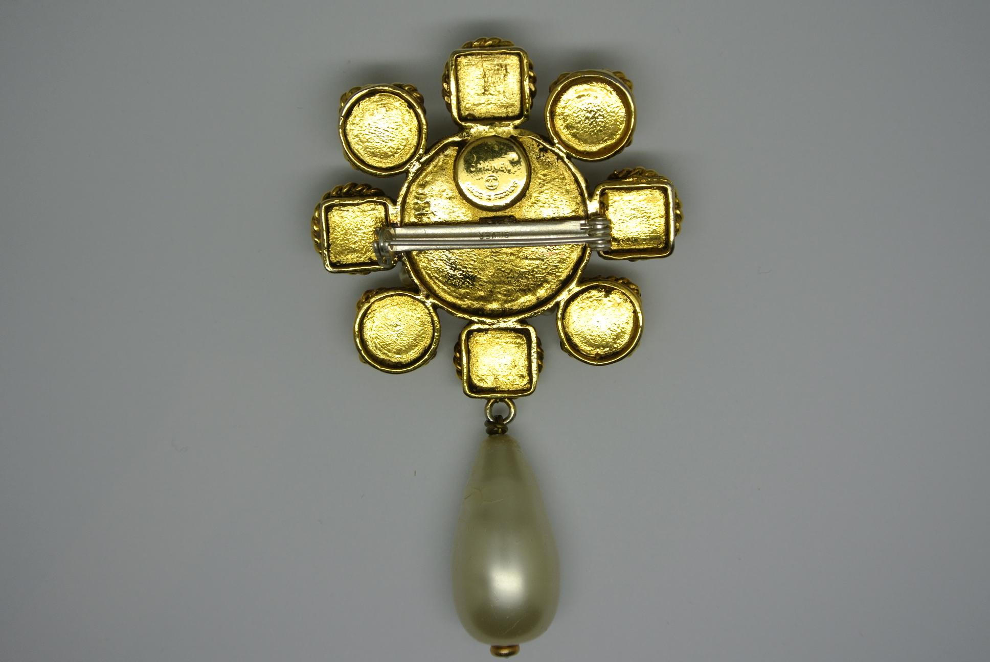 Classic Chanel brooch, comes with gold-plated metal, multi-colour poured glass and pearl drop.  The pin has been changed into silver-one by previous owner. 