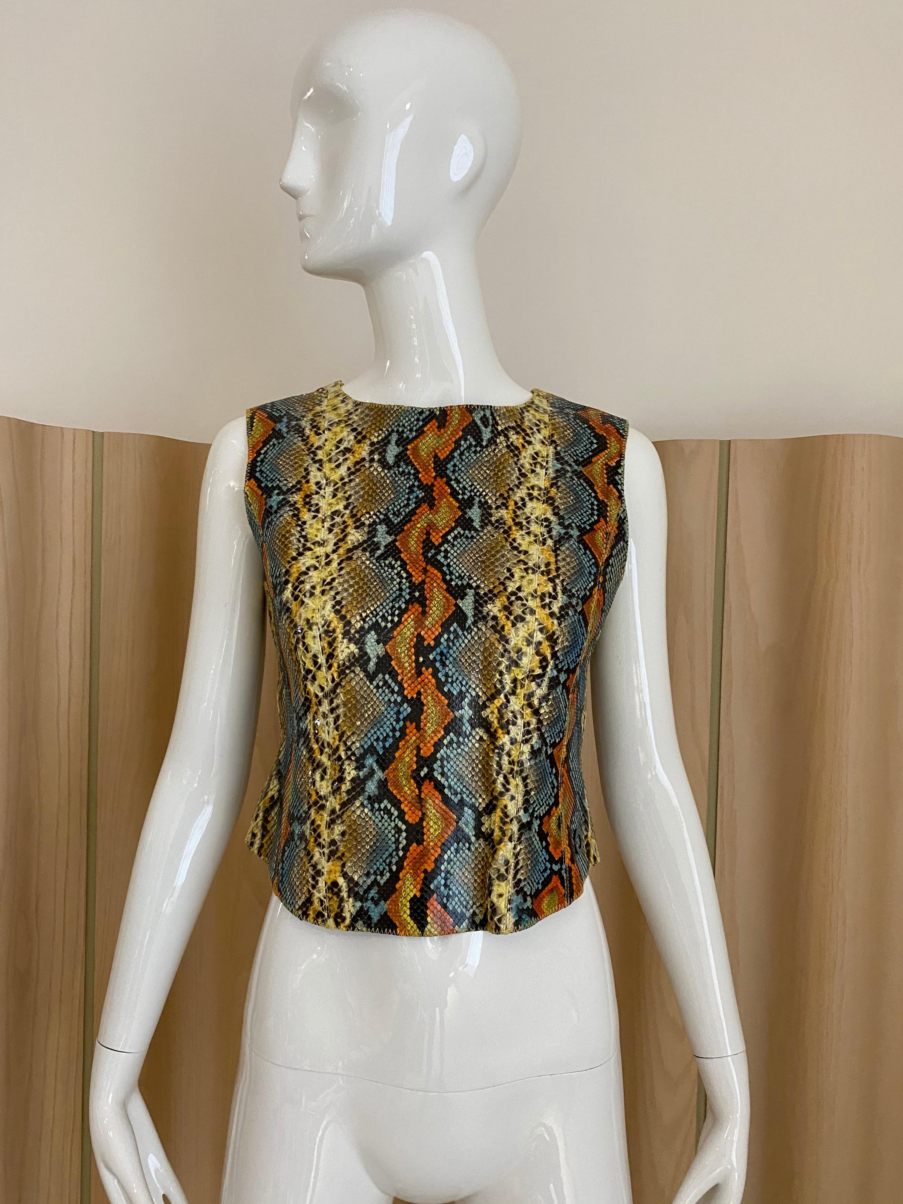90s Chanel snake skin top in orange, blue, yellow, and black. 
Top lined in silk . 
Size: US 4
*** some stains in lining. please see Image attached,