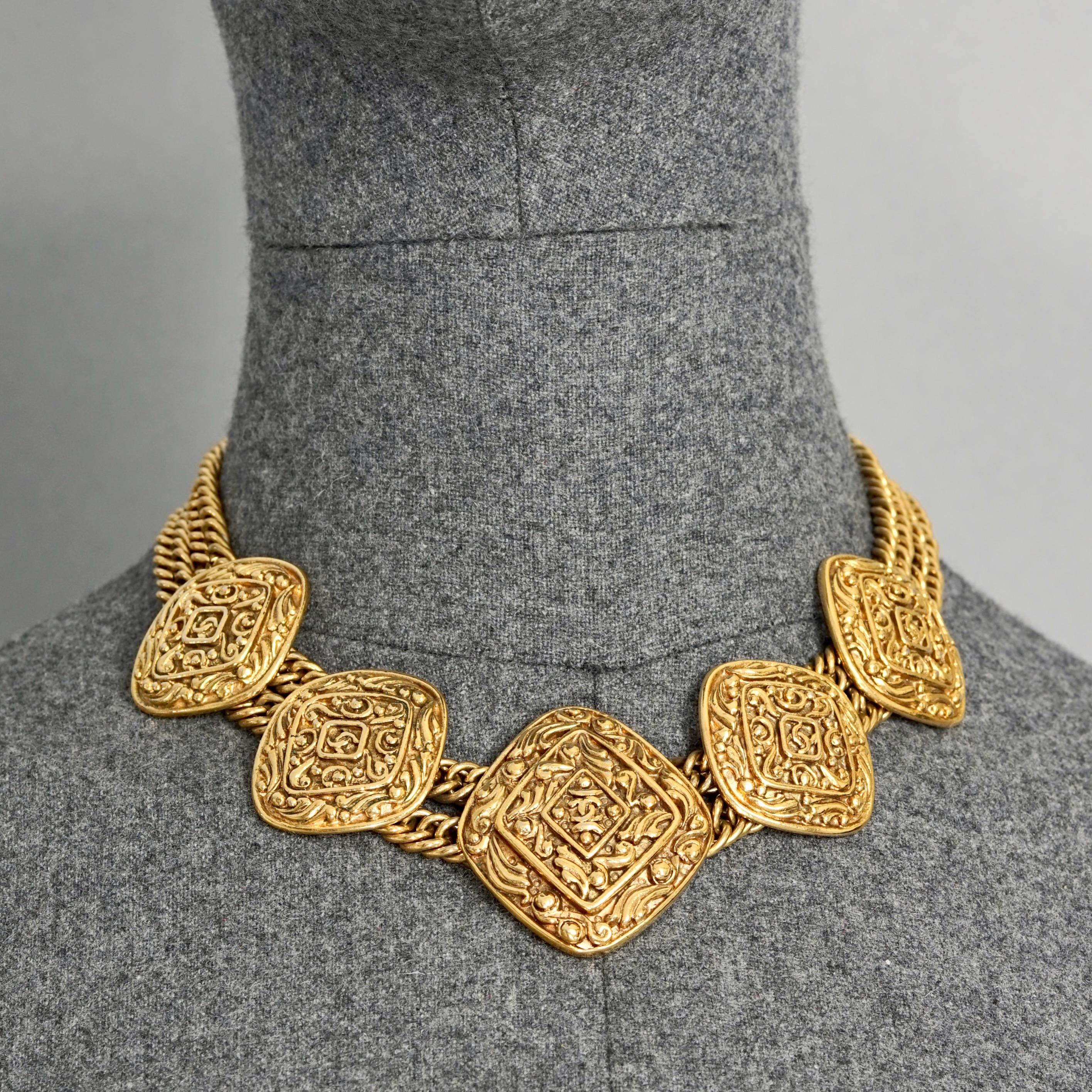 Vintage CHANEL Multi Logo Charm Double Chain Necklace

Measurements:
Height Large Pendant: 1.57 inches (4.6 cm)
Height Small Pendant: 1.18 inches (3.7 cm)
Wearable Length: 15.75 inches (40.5 cm)

Features:
- 100% Authentic CHANEL.
- 5 Ornate diamond