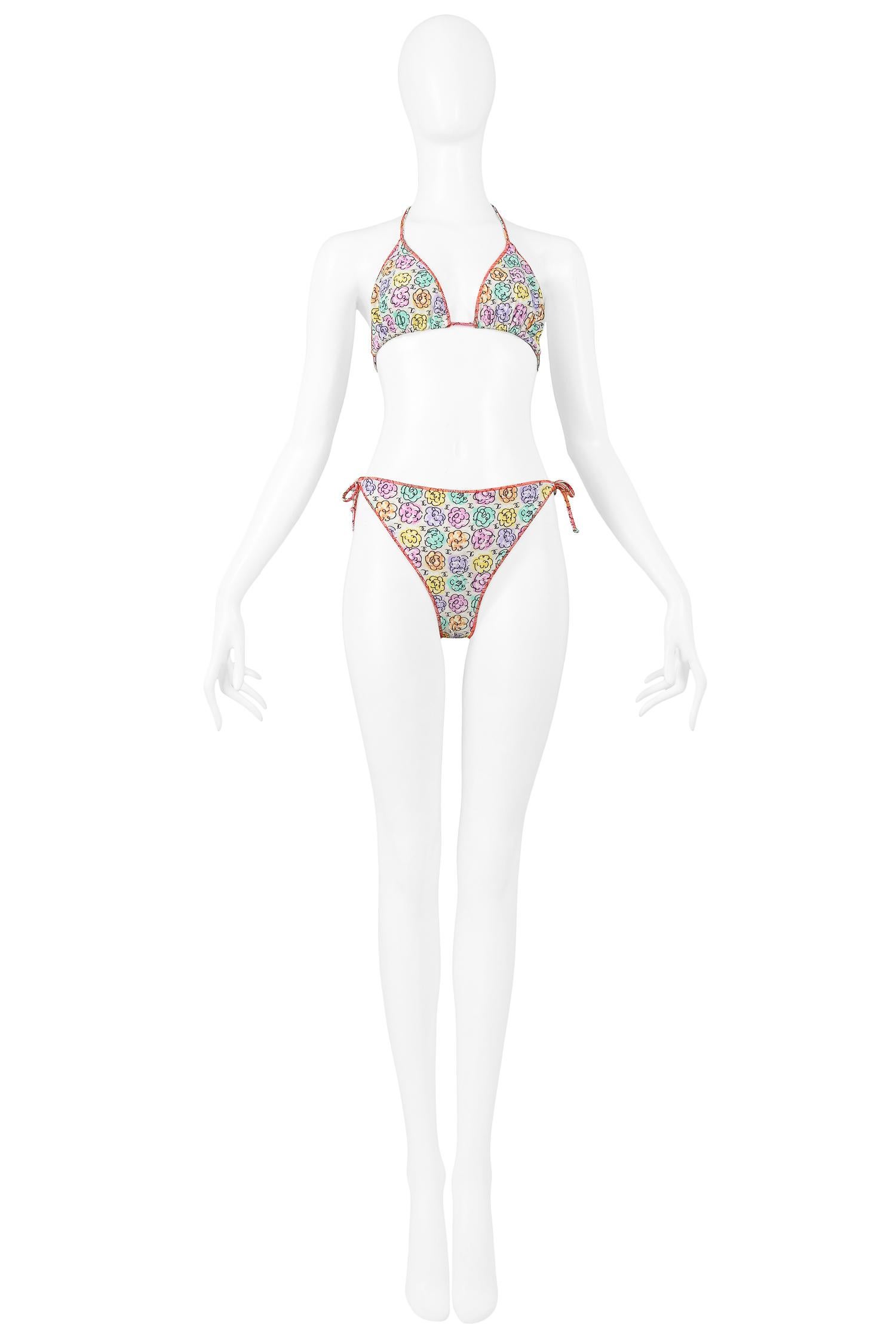 Vintage Chanel multicolor floral printed tie string bikini featuring exposed pop color stitch detail. 

Excellent Vintage Condition.

No Size Label. 
Would likely fit a size 38-40. Please inquire for measurements.