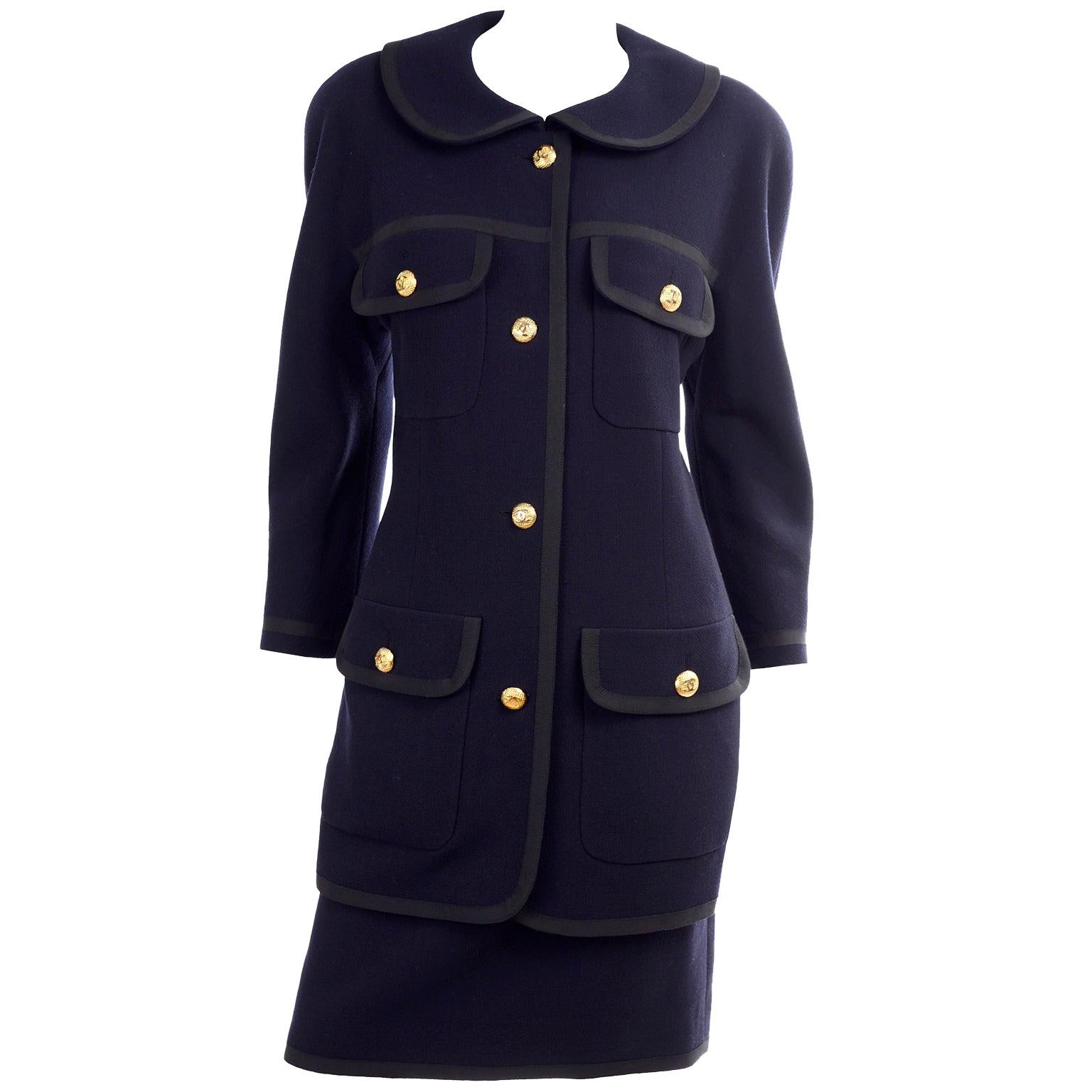 Vintage Chanel Navy Blue Skirt and Jacket Suit With Black Trim and Gold CC  Buttons For Sale at 1stDibs  navy blue suit with black trim, vintage chanel  suit, whose creation is the iconic boxy suit in tweed with braid trims,  gold buttons, and silk lining