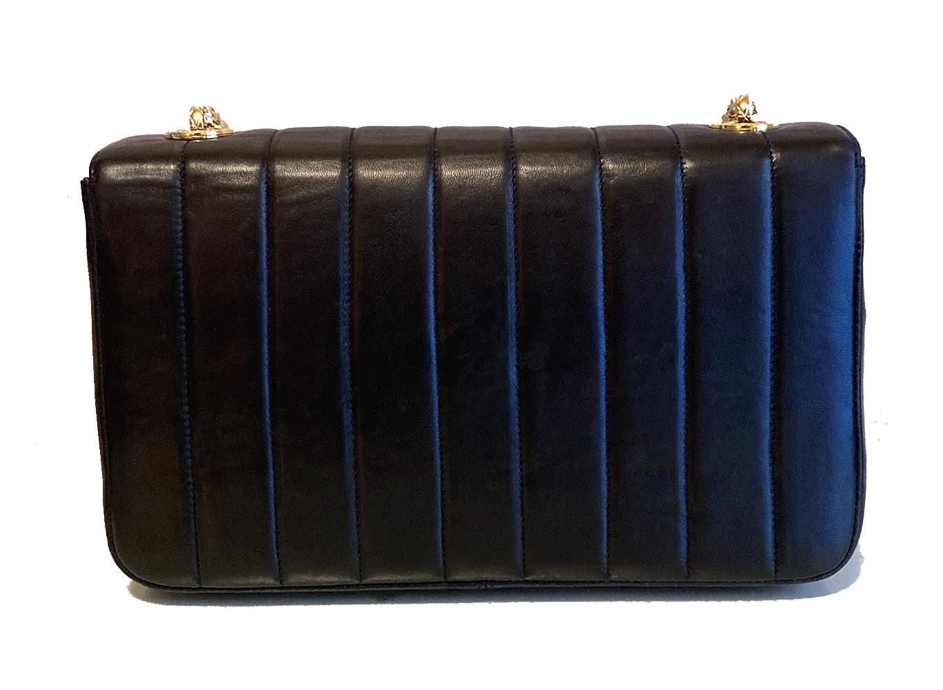 Vintage Chanel Navy Blue Stripe Quilted Classic Flap in very good condition. Navy blue lambskin exterior in rare and unique stripe quilted pattern trimmed with embossed gold hardware. Signature CC logo twist closure opens via single flap to a