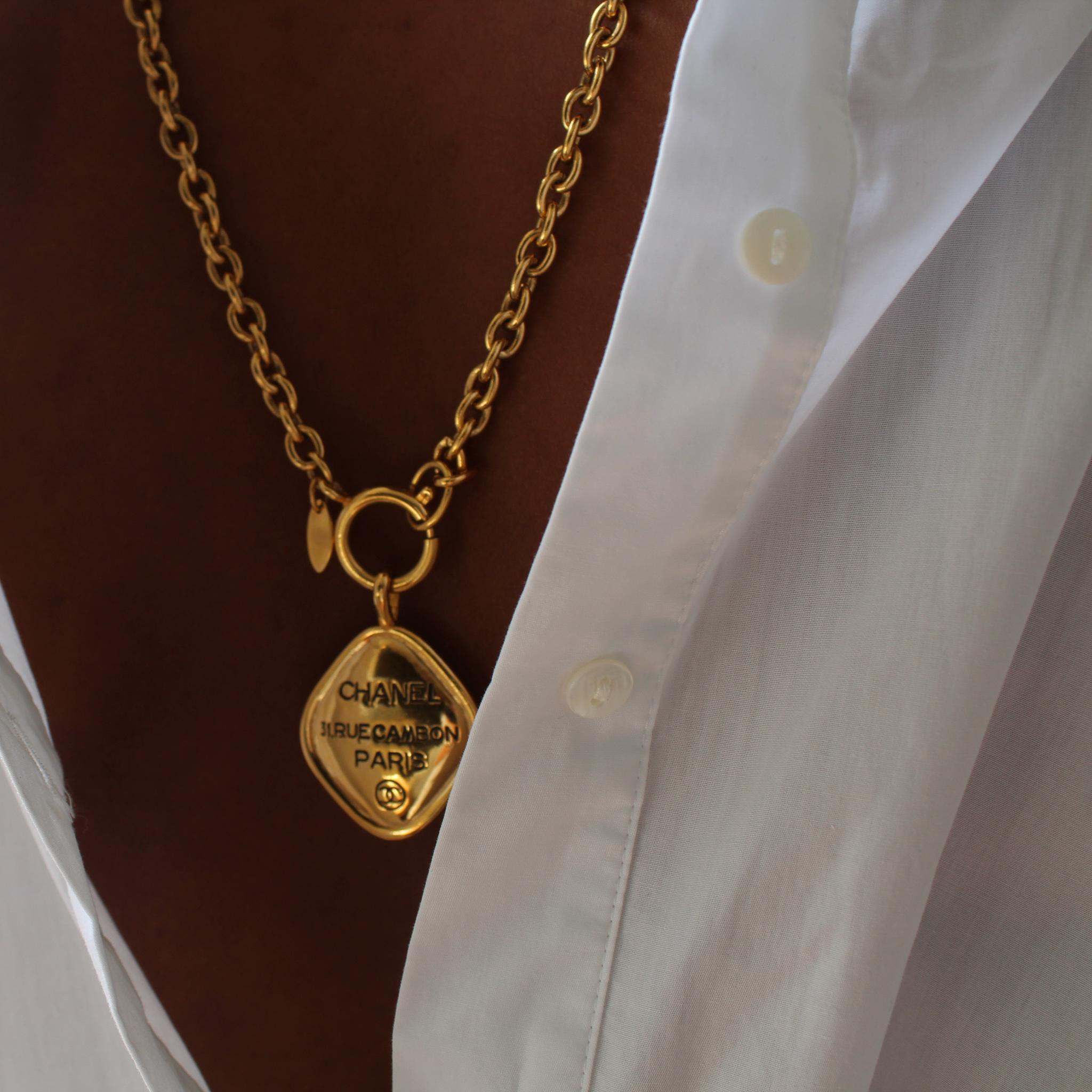 Vintage Chanel Necklace 1980s

Iconic Rue Cambon 24 karat gold-plated pendant necklace from Chanel, still the world's most in-demand fashion label. Features a substantial belcher chain with a diamond shaped pendant embossed with the legendary