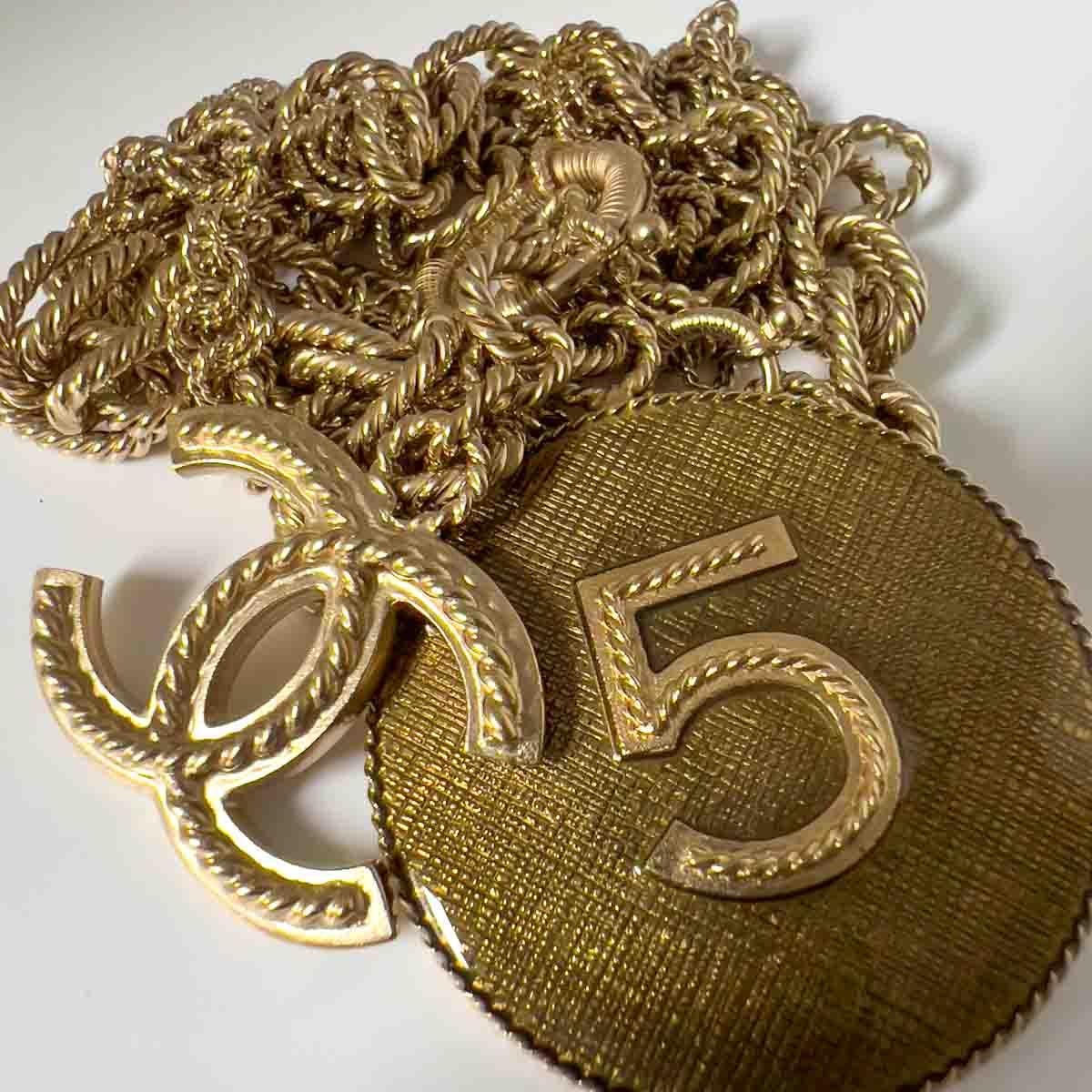 A seriously spectacular Chanel CC Charm Necklace from the Spring Summer 2013 Collection. Crafted in antiqued light gold metal. An intricately designed chunky nautical style rope chain, paying homage to Coco's love affair with the sea, gives way to