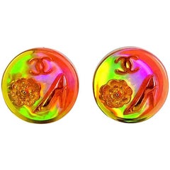 Vintage CHANEL orange aurora earrings with Chanel iconic motif charms.