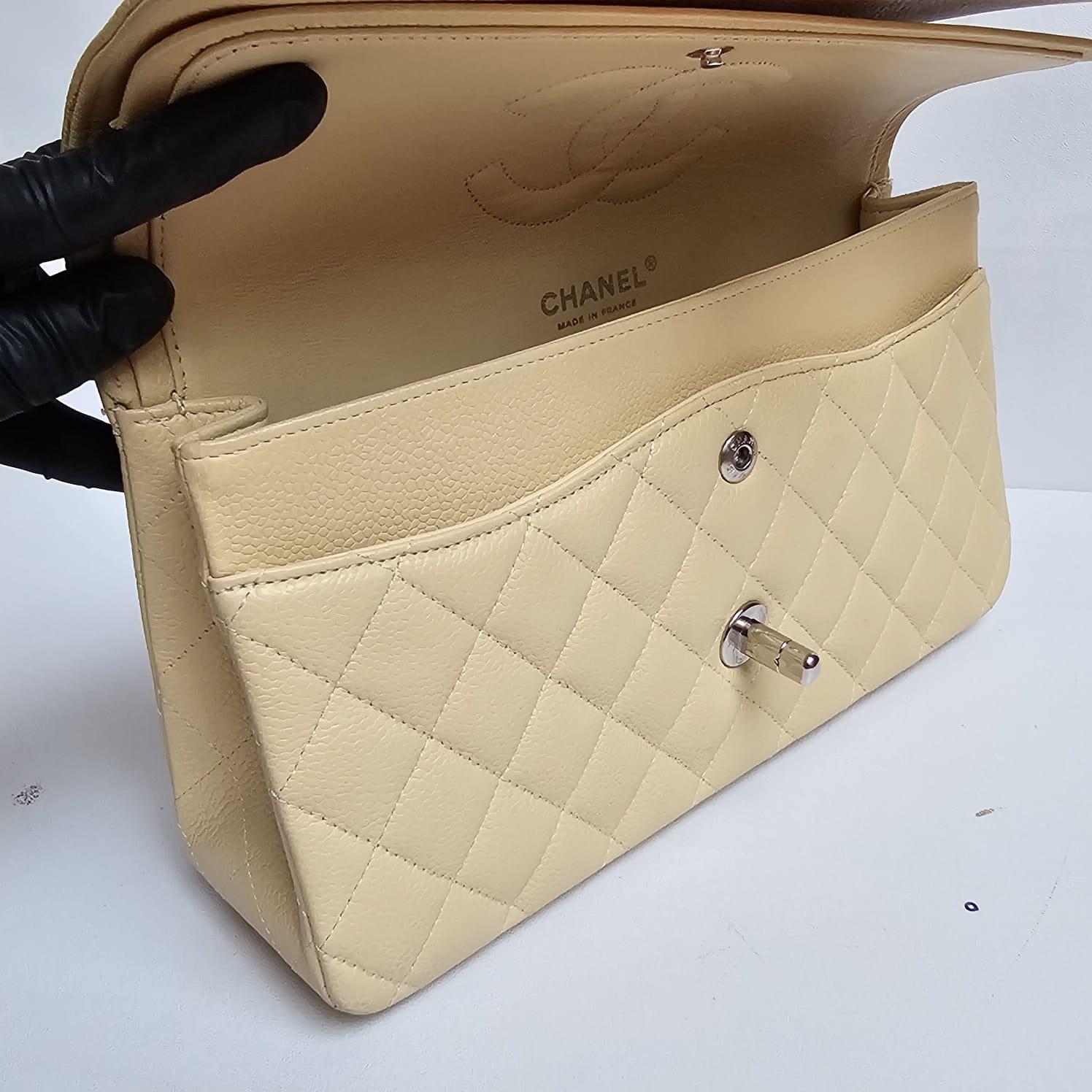 Beatiful classic chanel medium flap in pastel yellow color (almost lighter beige-like) with silver hardware. Series #11 from mid 2000s. Overall still in very good condition. Comes with its holo, card and replacement dust bag.
