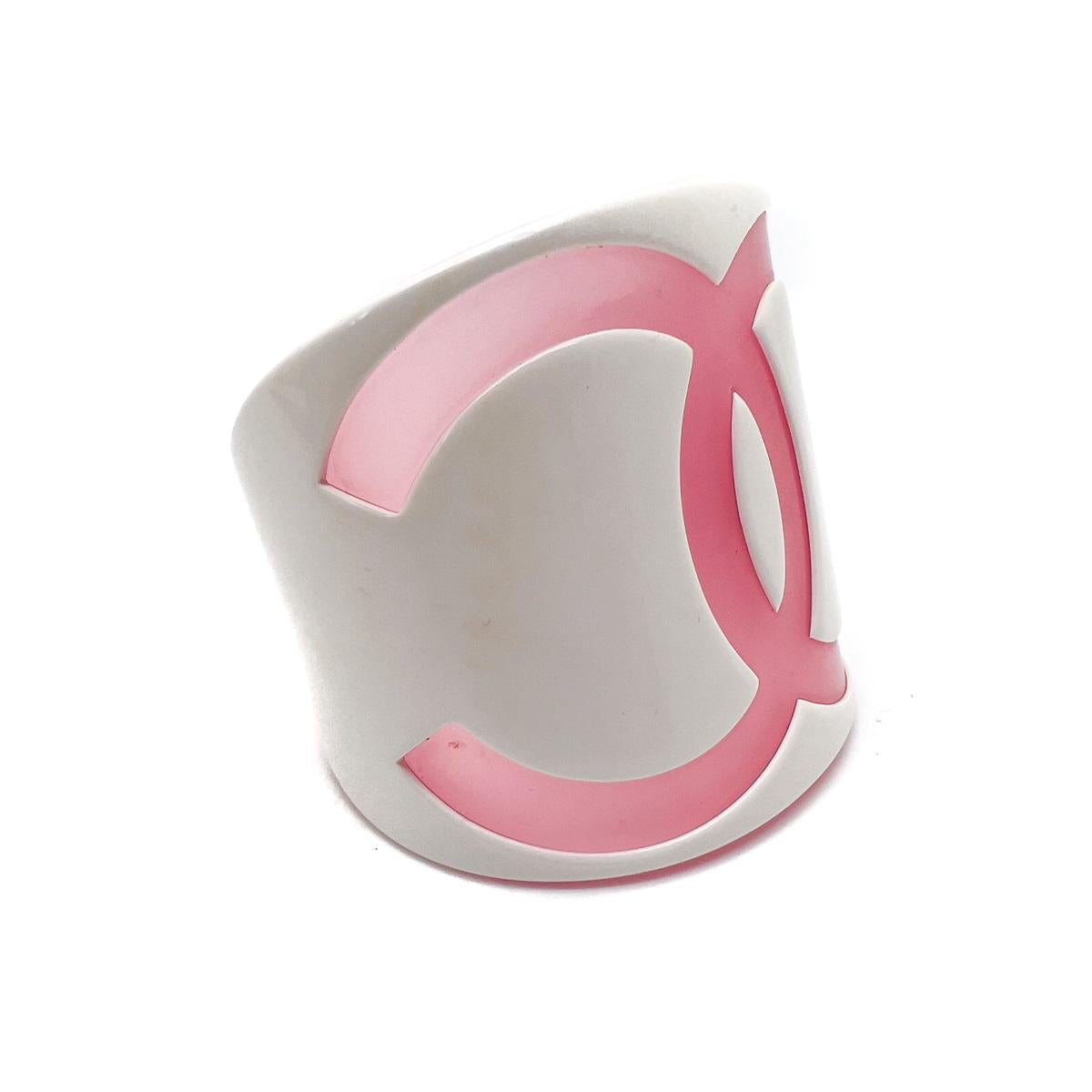 A dreamy vintage noughties Chanel pink cuff that will be adored and coveted.

Vintage Condition: Very good without damage or noteworthy wear.
Signed: Chanel, 2001
Materials: Resin
Fastening: None
Approximate Dimensions: 6cm inner diameter, 2.8cm