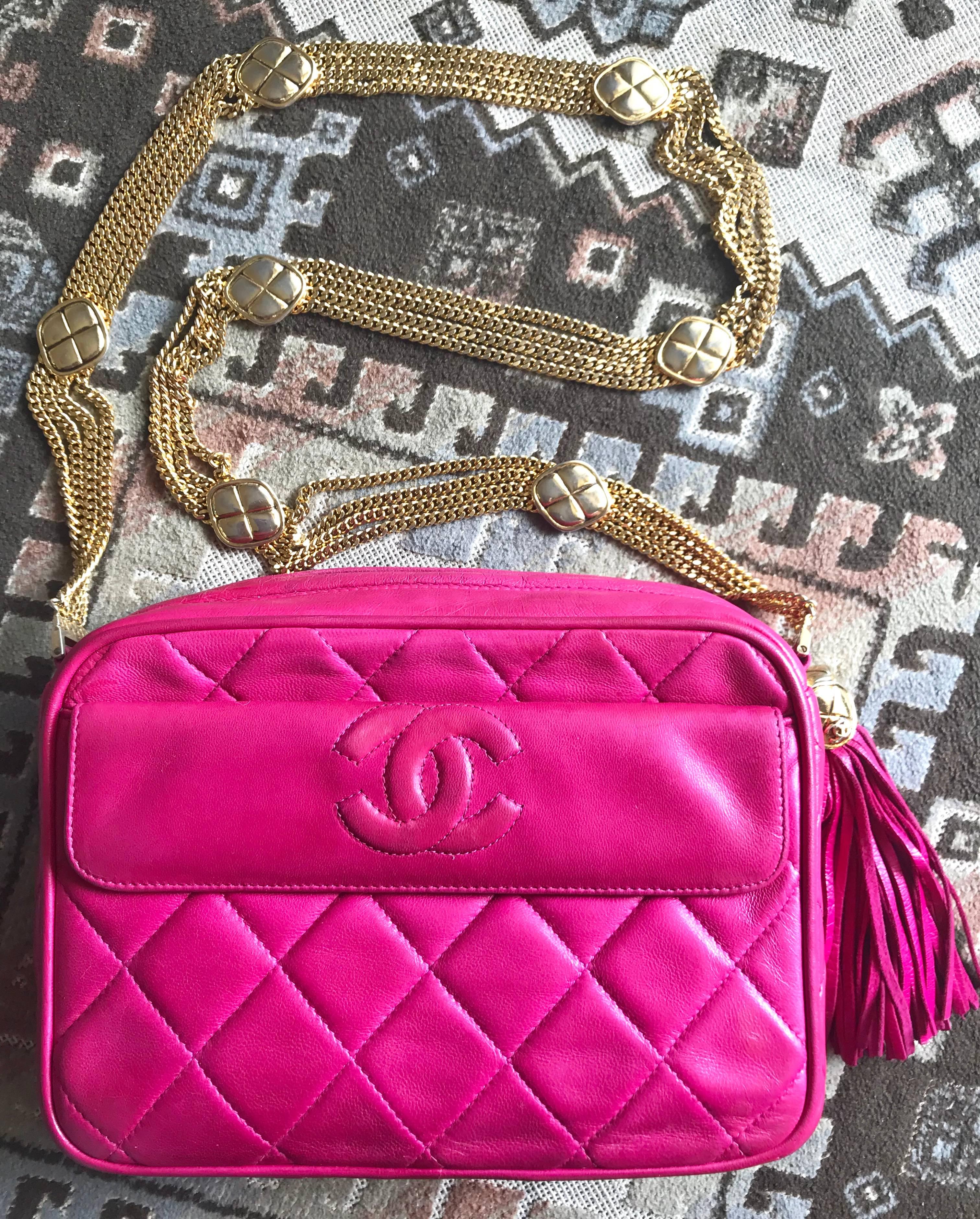 1990s. Vintage CHANEL pink leather camera bag style shoulder bag with a tassel, CC mark, and multiple layer chain strap. Rare masterpiece.

Introducing one-of-a-kind, rare vintage purse from CHANEL back in the early 90's.
Vintage lambskin pink