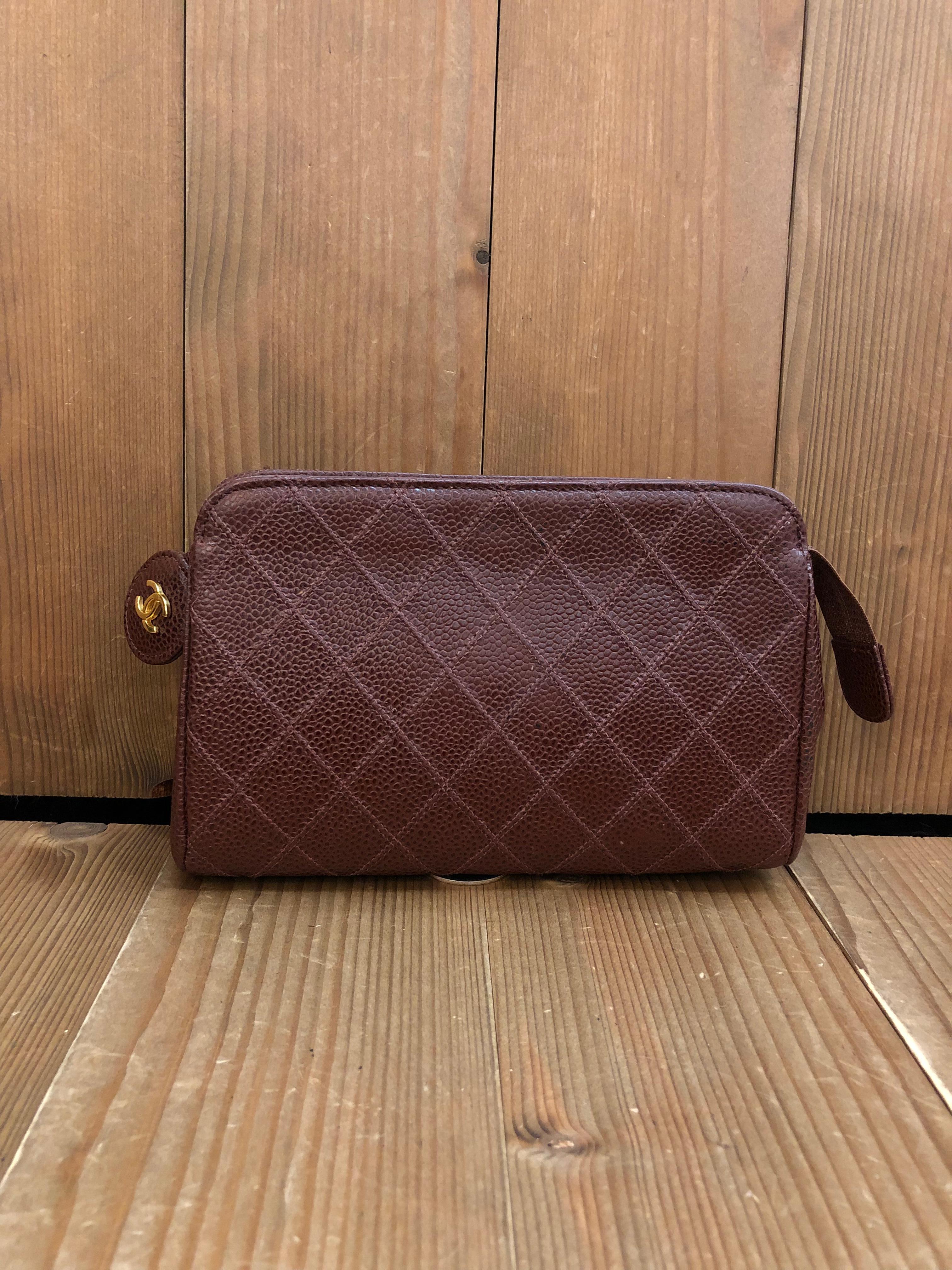 This vintage CHANEL pouch clutch bag is crafted of brown caviar calfskin leather in diamond quilted pattern. Top zipper closure opens to a new beige interior. 5xxxxxx holo sticker. Measures approximately 7 x 4.25 x 2 inches.

Condition: Good vintage
