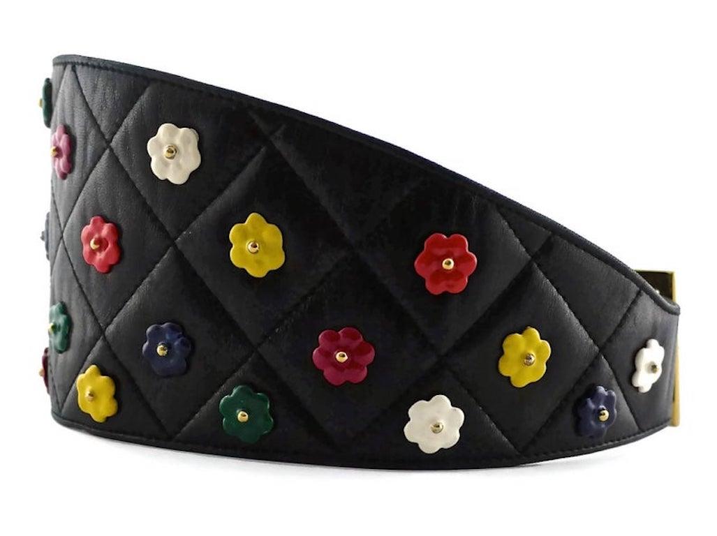 Vintage CHANEL Quilted Colourful Camellia Leather Corset Belt

Measurements:
Height: 4.33 inches (11 cm)
Will Fit Waists: 26.4 inches (67 cm), 27.16 inches (69 cm) and 28.3 inches (72 cm)

Features:
- 100% Authentic CHANEL.
- Black quilted wide